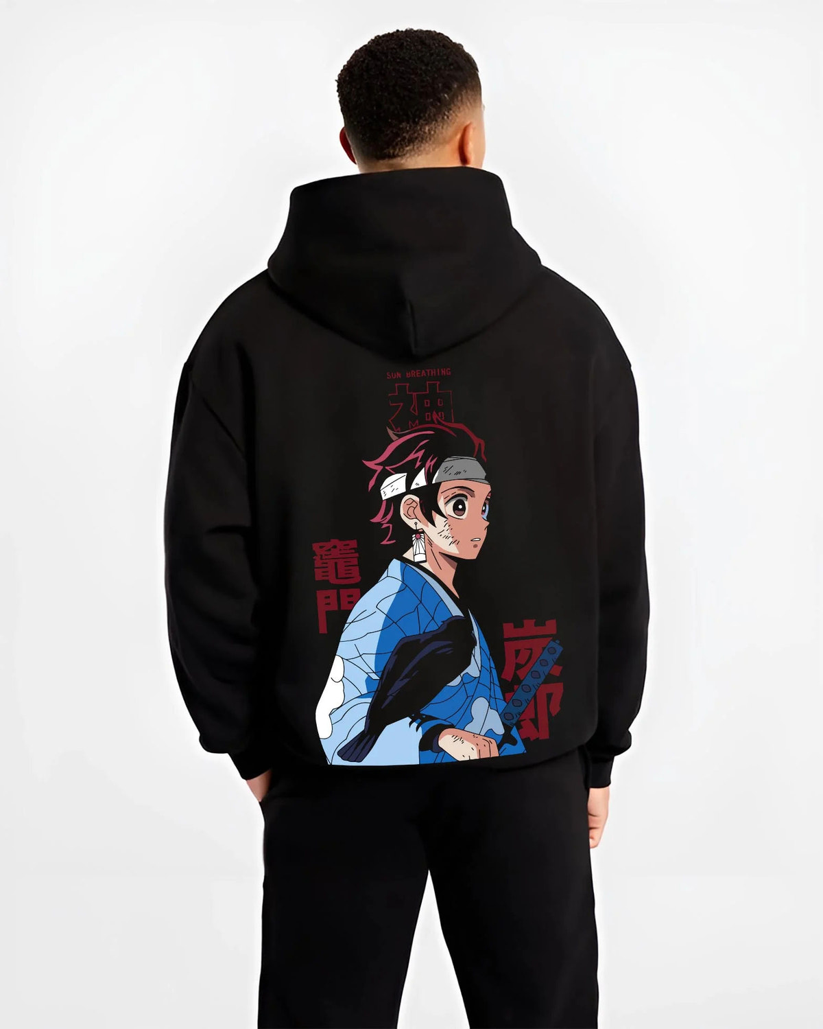 Black hoodie worn by male model from the back featuring Tanjiro Kamado Demon Slayer Mark artwork.