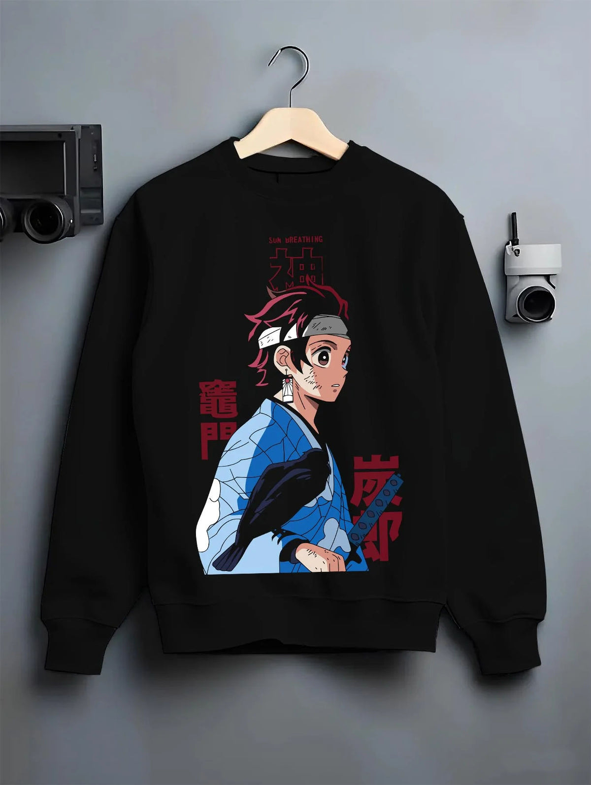 Black crewneck sweatshirt on hanger featuring Tanjiro Kamado Demon Slayer Mark artwork.