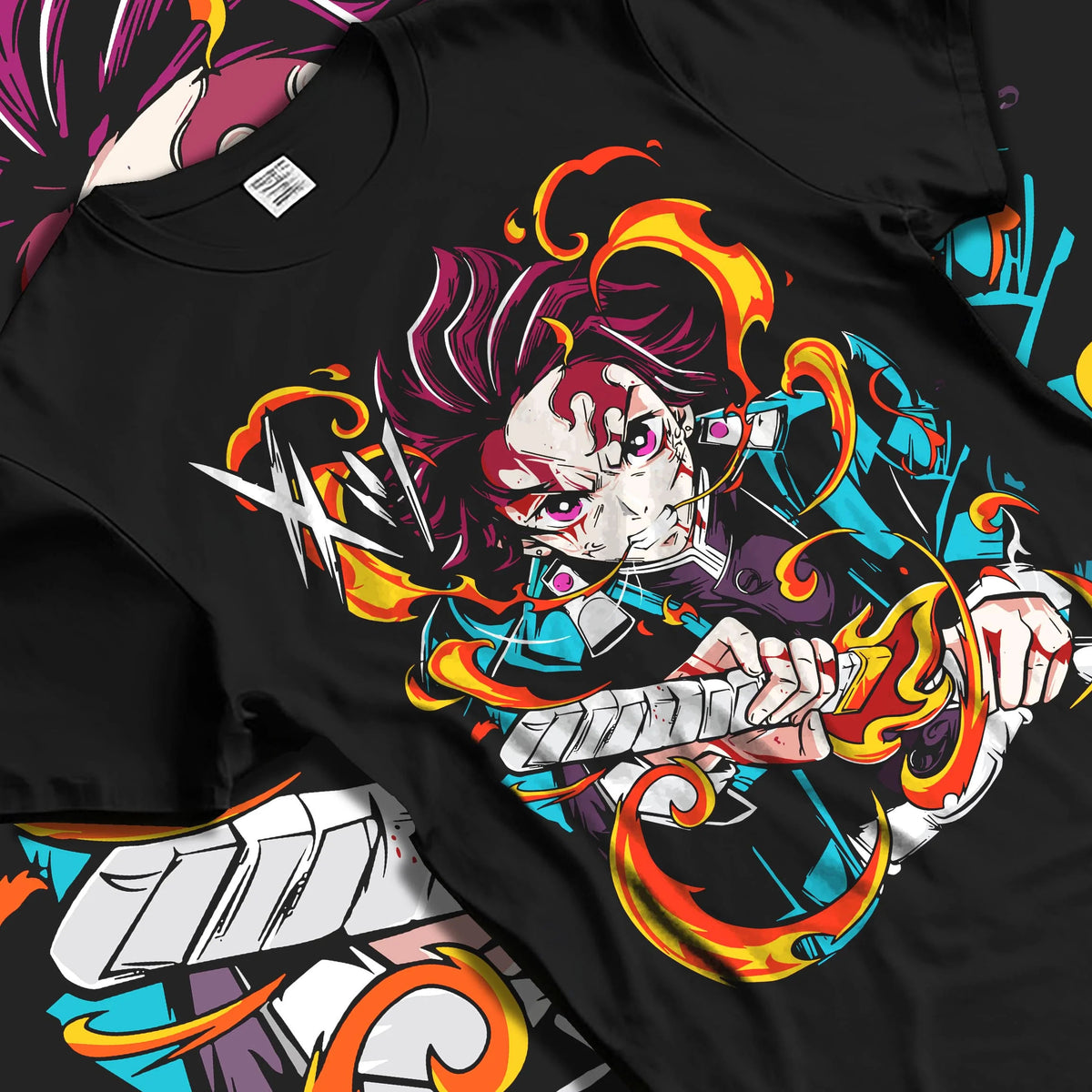 Black T-shirt laid flat with natural folds featuring Tanjiro Kamado Hinokami Kagura flame sword Demon Slayer artwork.