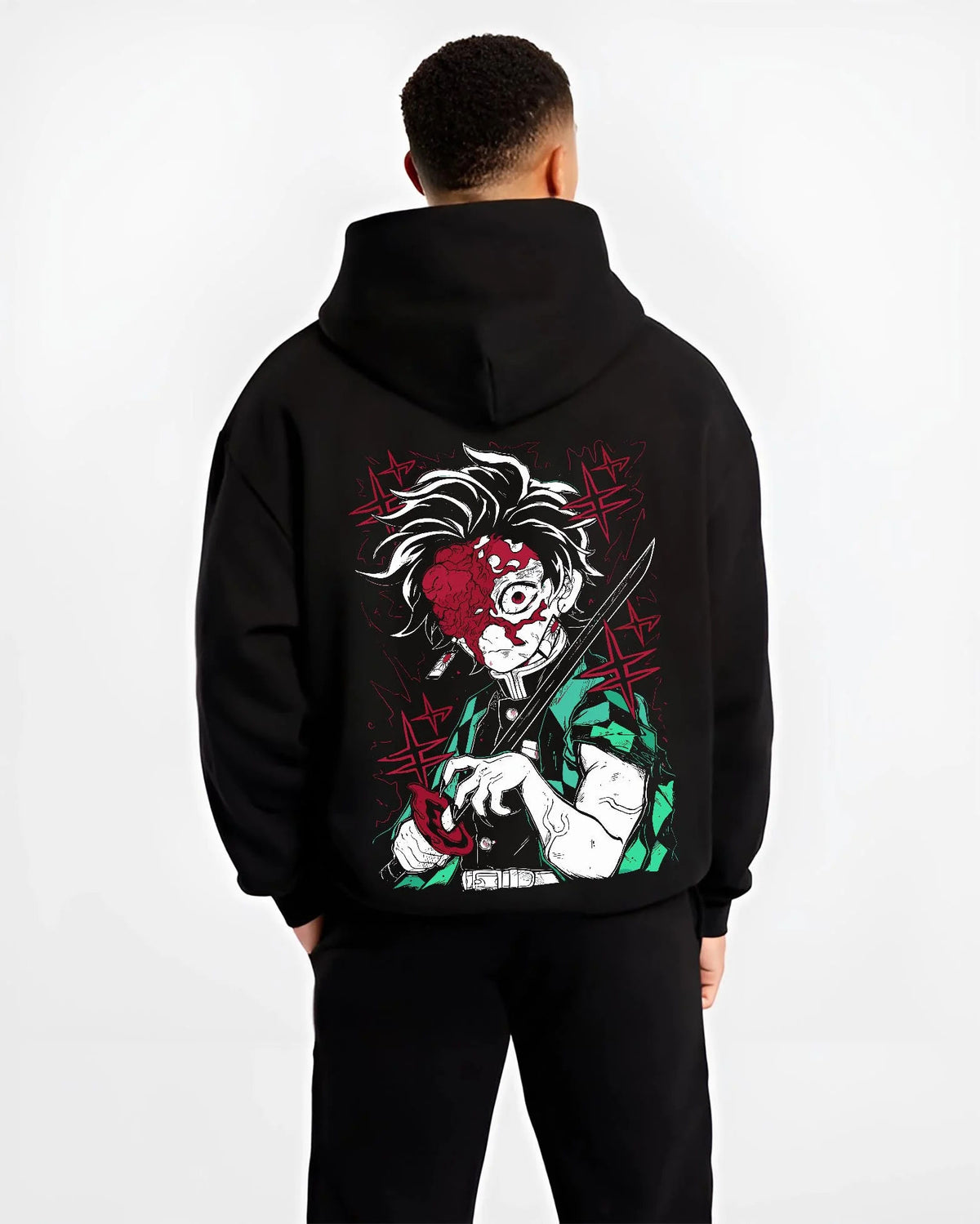 Black hoodie worn by male model from the back featuring Tanjiro Kamado Sun Breathing battle scar Demon Slayer artwork.