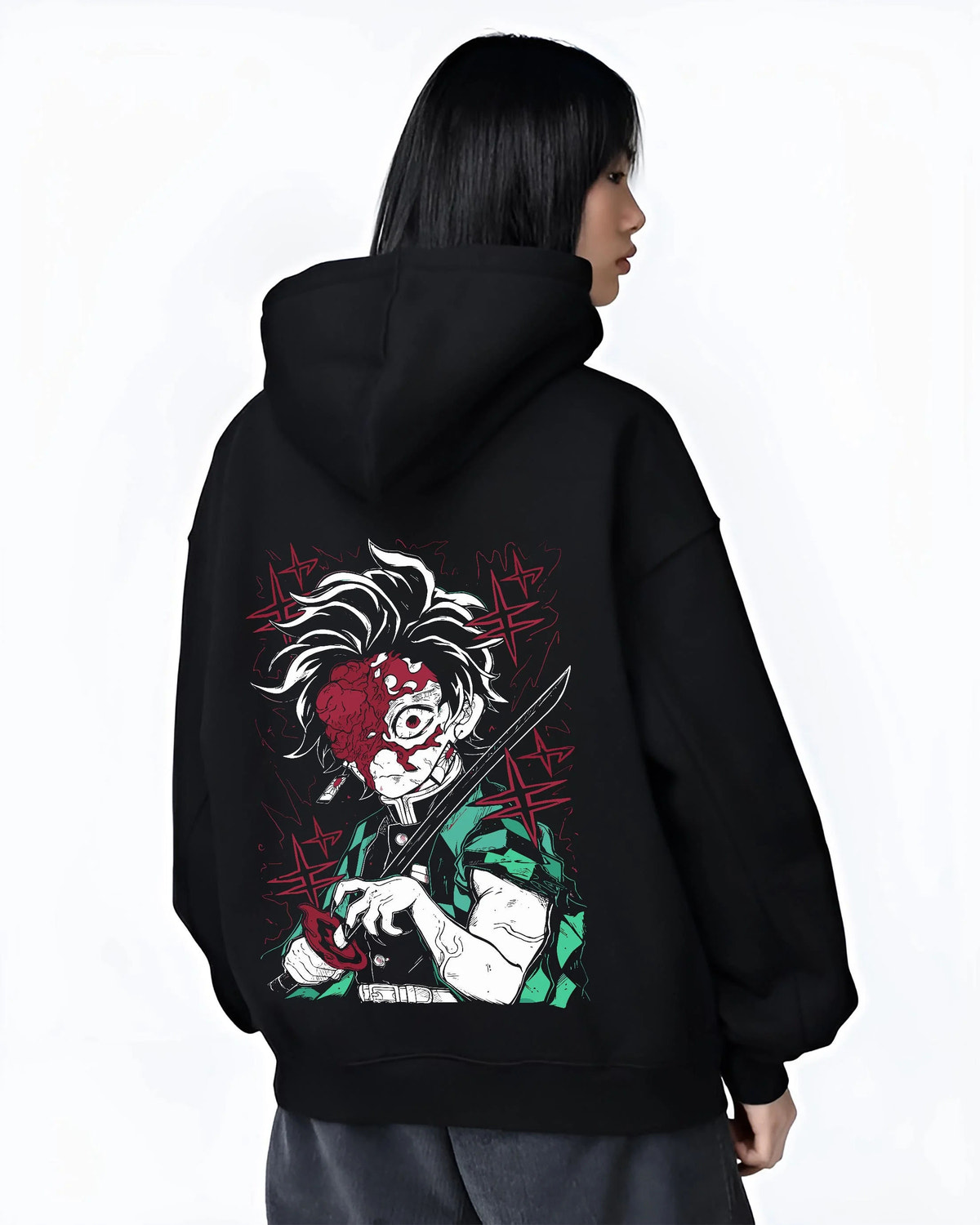 Black hoodie worn by female model from the back featuring Tanjiro Kamado Sun Breathing battle scar Demon Slayer artwork.
