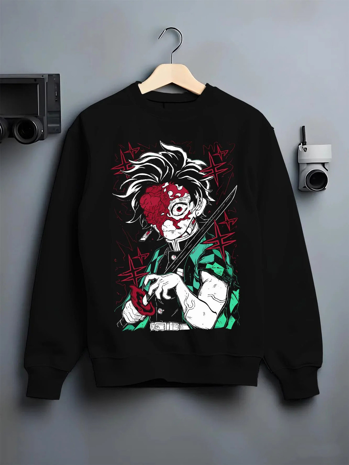 Black crewneck sweatshirt on hanger featuring Tanjiro Kamado Sun Breathing battle scar Demon Slayer artwork.