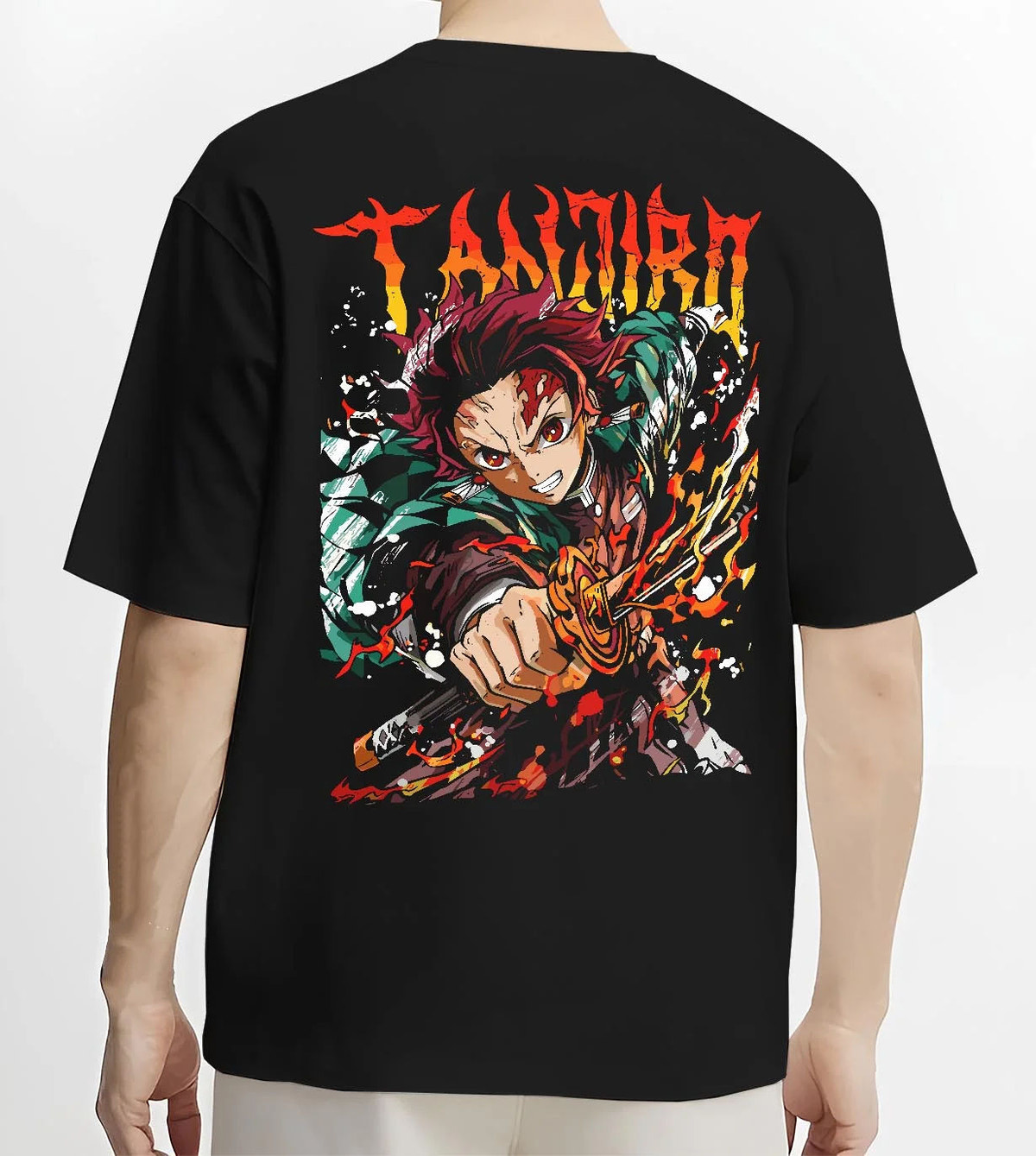 Black T-shirt worn by male model from the back featuring Tanjiro Kamado flame sword Hinokami battle Demon Slayer artwork.