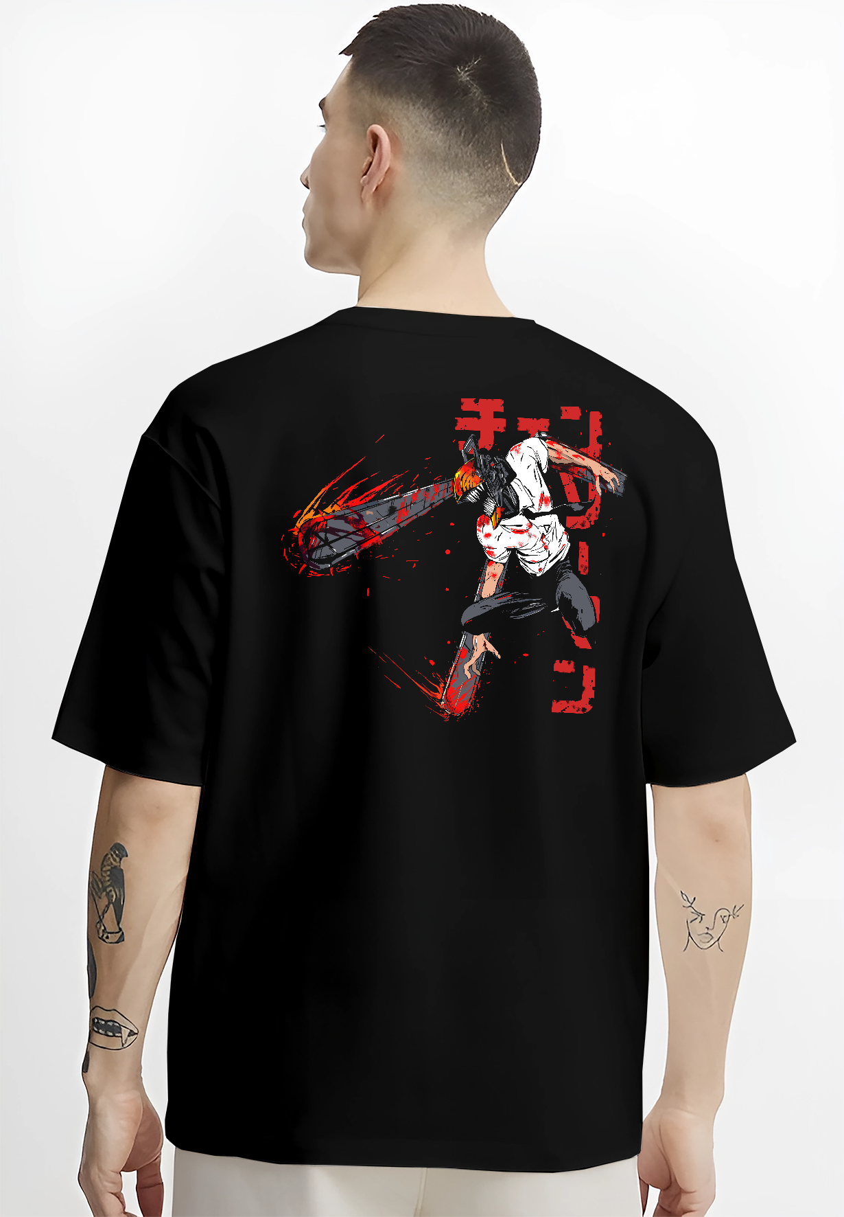 Black T-shirt worn by a male model, back view, featuring Denji Chainsaw Man Japanese animation streetwear graphic in dark manga panel artwork style with bloody retro battle design.