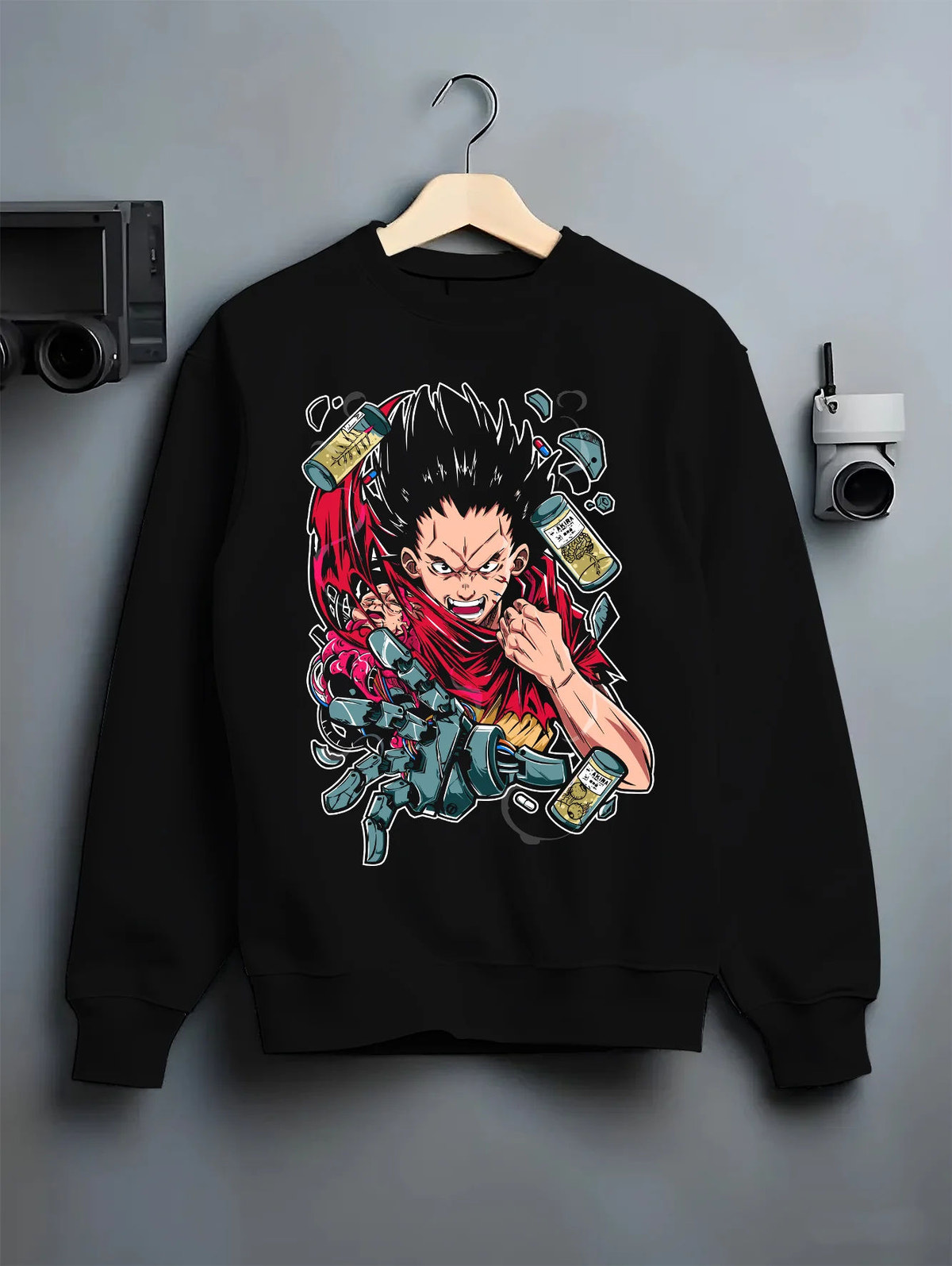 Black crewneck sweatshirt on hanger showing Tetsuo Shima from Akira: cybernetic red jacket artwork