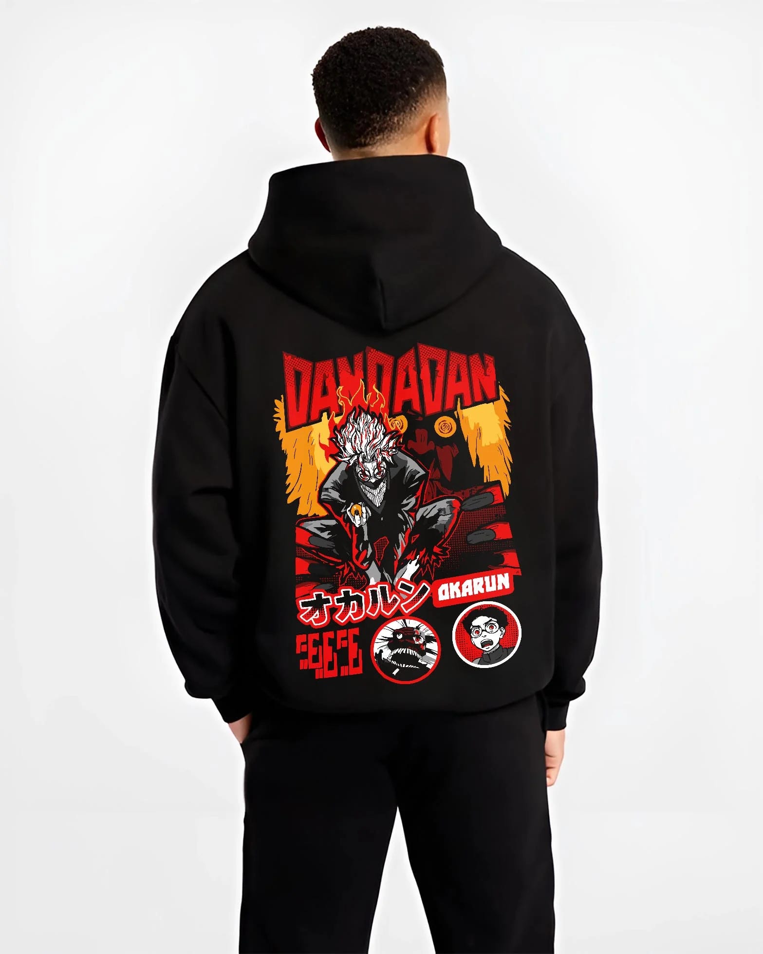 Black hoodie worn by male model, back view with Okarun Hoodie Dandadan Possessed Spirit Alien Fight graphic Okarun anime design.
