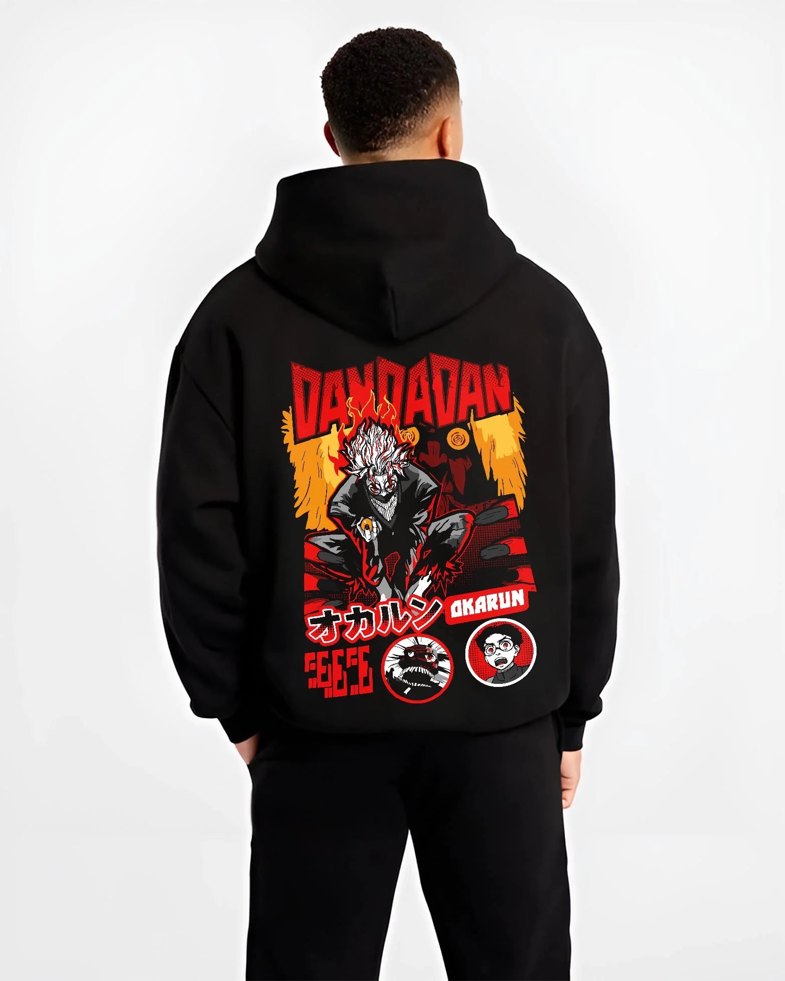 Black hoodie worn by male model, back view with Okarun Hoodie Dandadan Possessed Spirit Alien Fight graphic Okarun anime design.