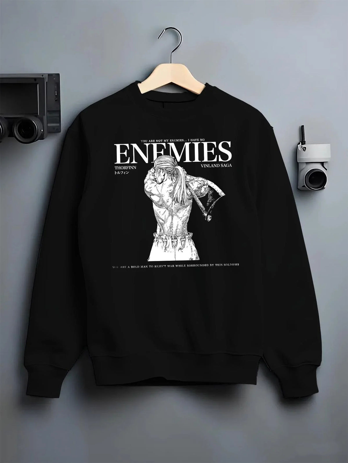 Black crewneck sweatshirt on hanger featuring Thorfinn enemies Viking revenge Vinland Saga artwork.