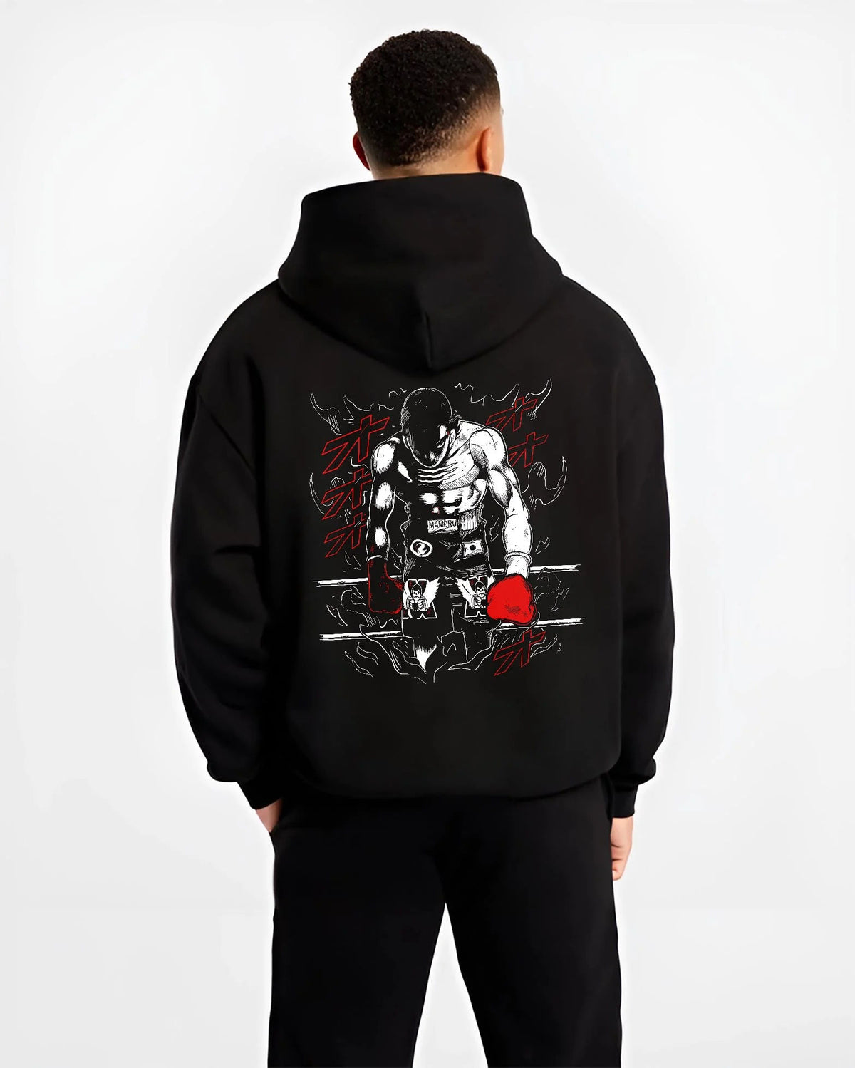 Black hoodie worn by male model from the back featuring Mamoru Takamura boxing champion Hajime no Ippo artwork.