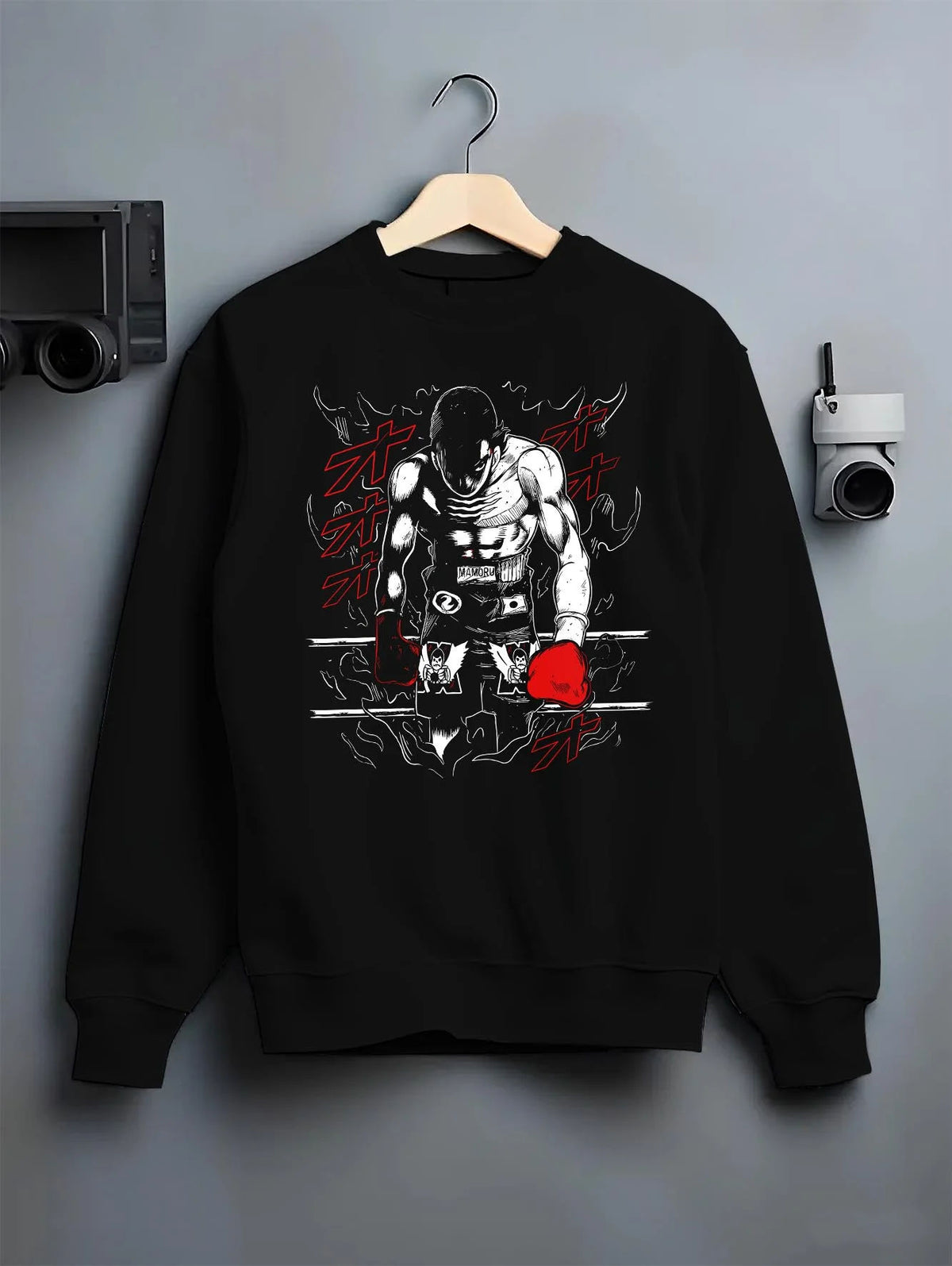 Black crewneck sweatshirt on hanger featuring Mamoru Takamura boxing champion Hajime no Ippo artwork.