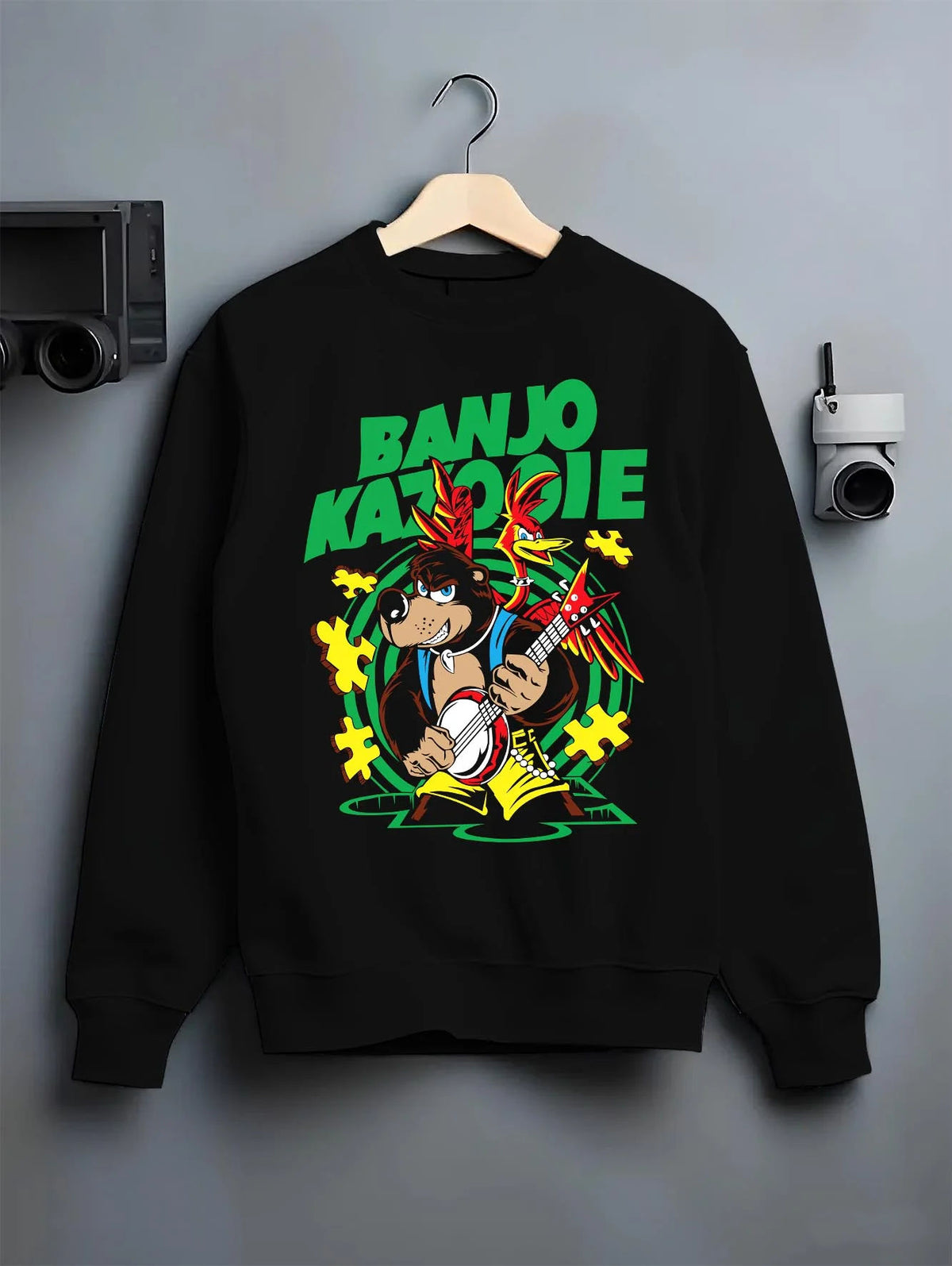 Black crewneck sweatshirt on hanger featuring Banjo and Kazooie bear bird adventure Banjo-Kazooie artwork.