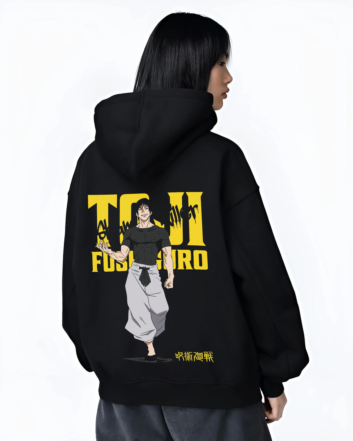 Black hoodie female model back view showing Toji Fushiguro from Jujutsu Kaisen: yellow title poster