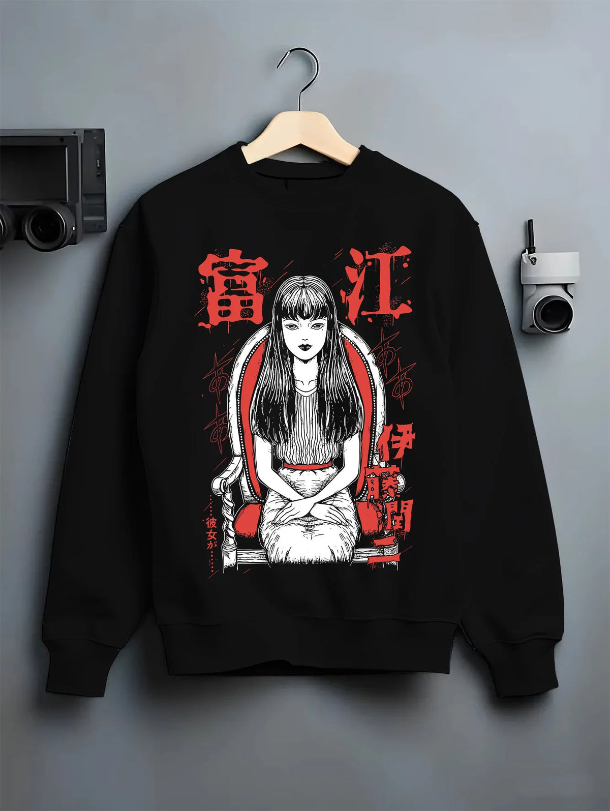 Black crewneck sweatshirt on hanger showing Tomie Kawakami from Junji Ito: horror manga long-haired girl