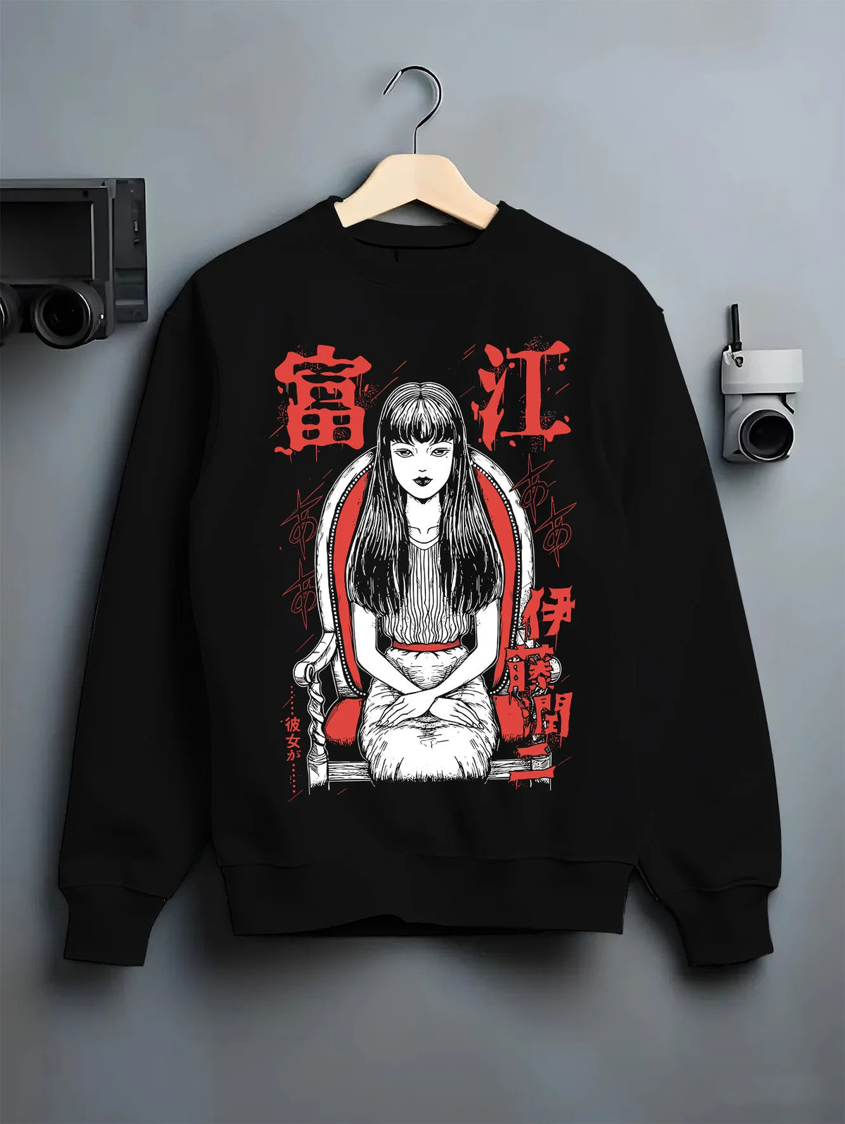 Black crewneck sweatshirt on hanger showing Tomie Kawakami from Junji Ito: horror manga long-haired girl