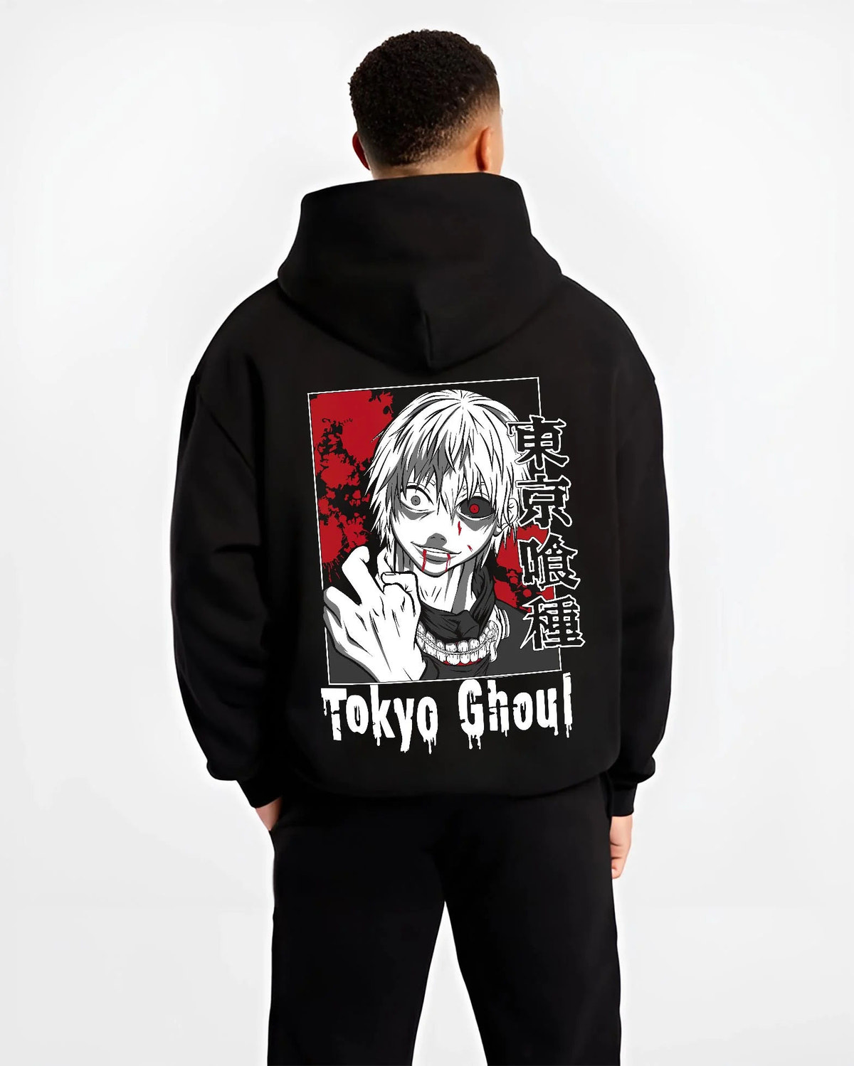 Black hoodie worn by male model from the back featuring Ken Kaneki One-Eyed Ghoul mask portrait Tokyo Ghoul artwork.