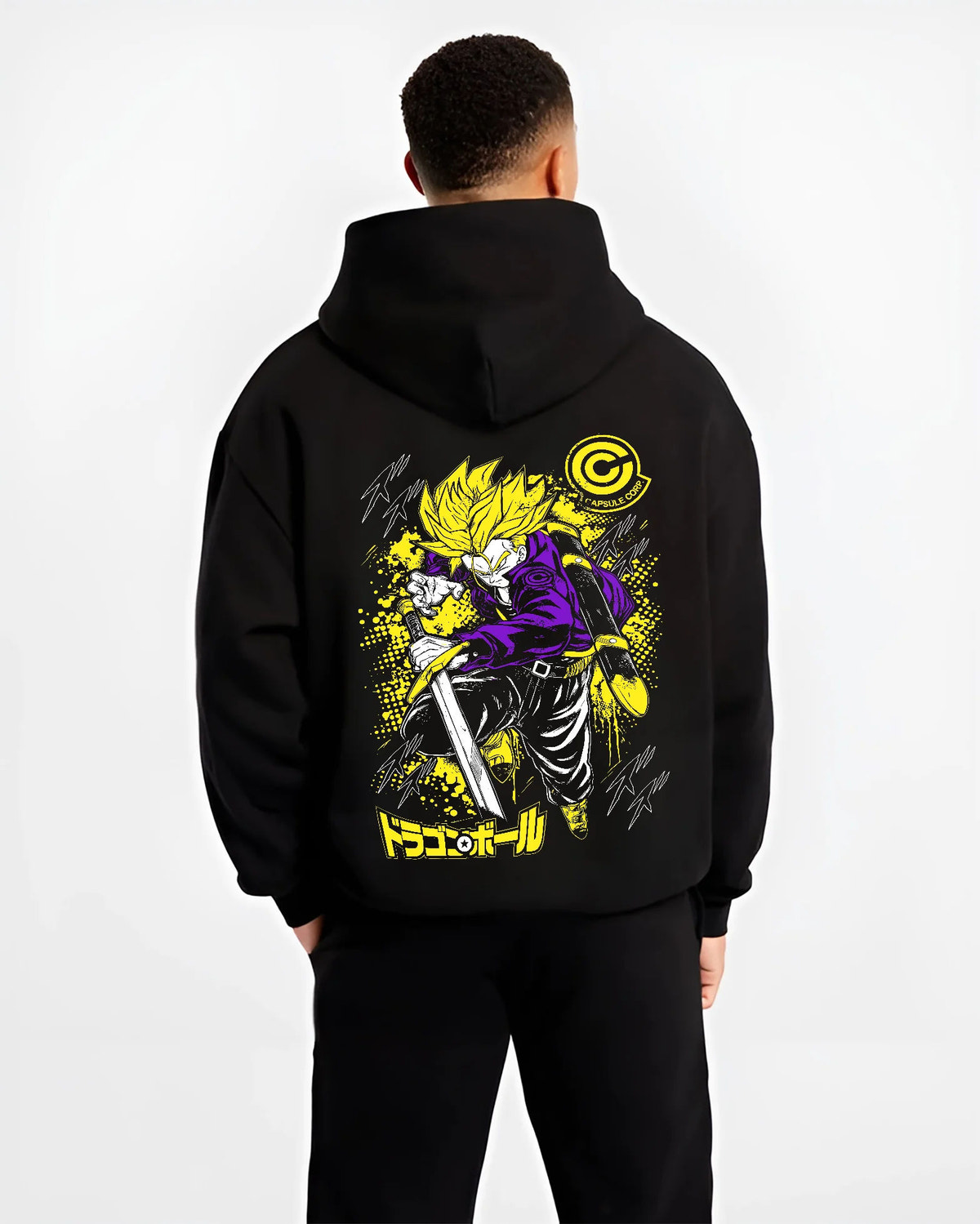 Black hoodie model back view showing Future Trunks from Dragon Ball: Super Saiyan sword pose