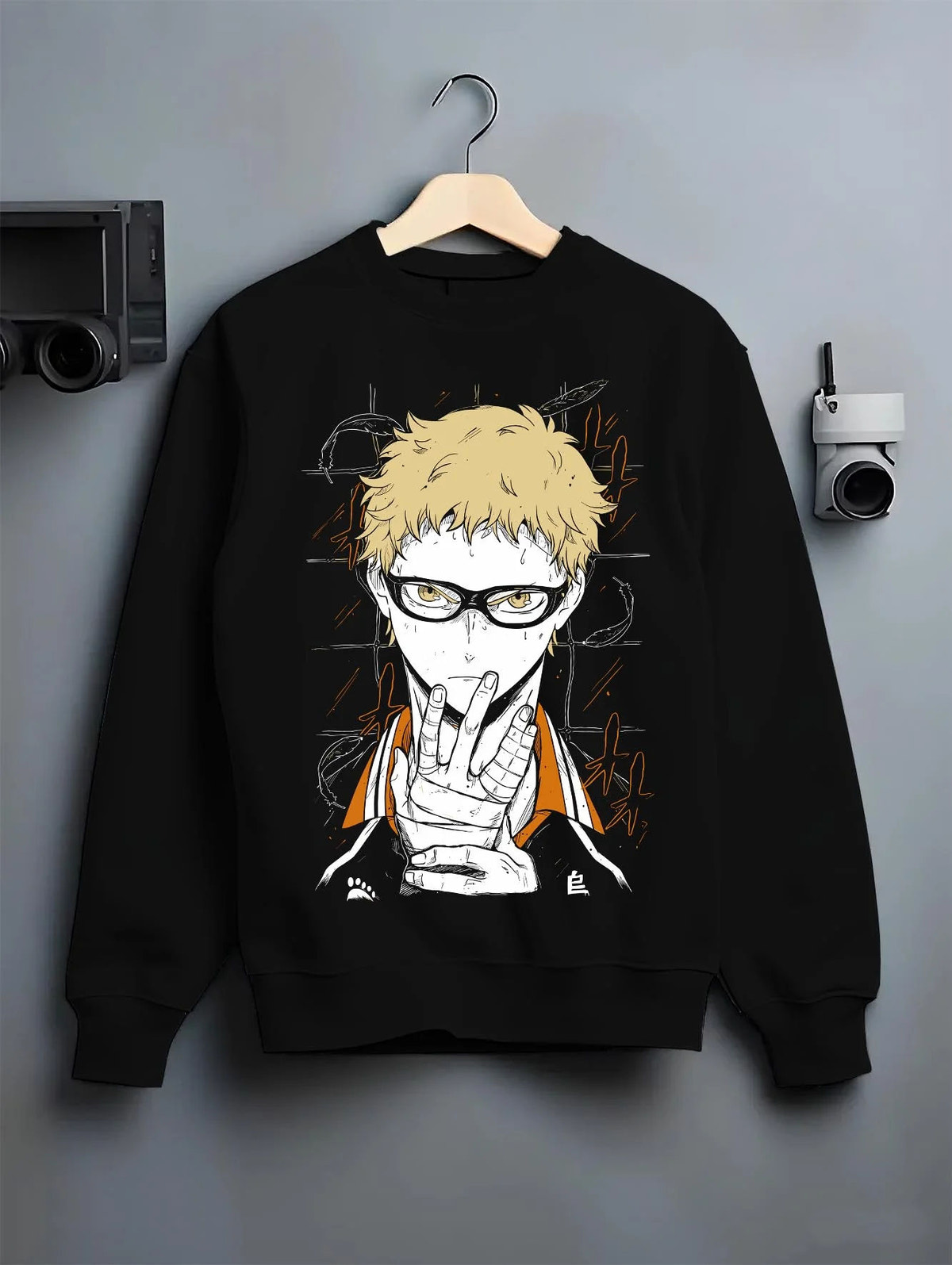 Black crewneck sweatshirt on hanger featuring Kei Tsukishima Karasuno blocker Haikyuu artwork.