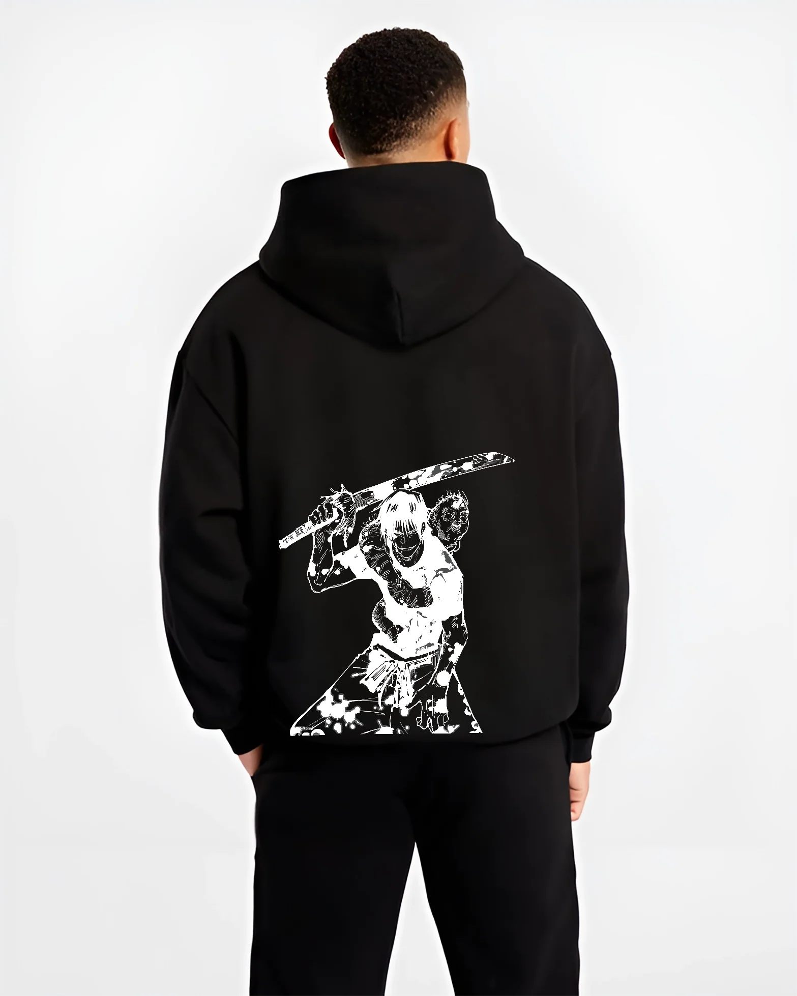 Person wearing a black Toji hoodie with a white graphic design on the back against a white background