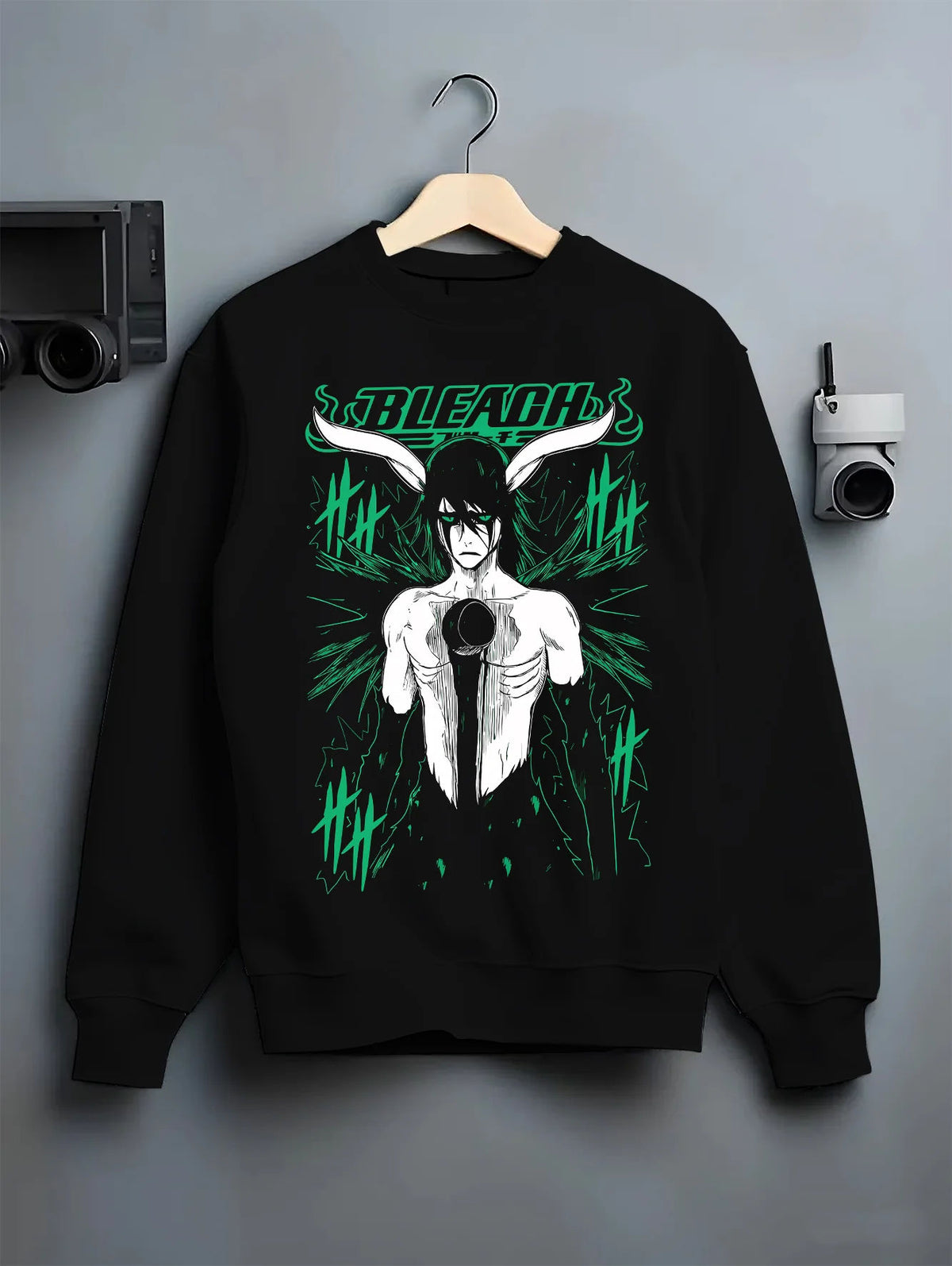 Black crewneck sweatshirt on hanger showing Ulquiorra Cifer from Bleach: Hollow form character print