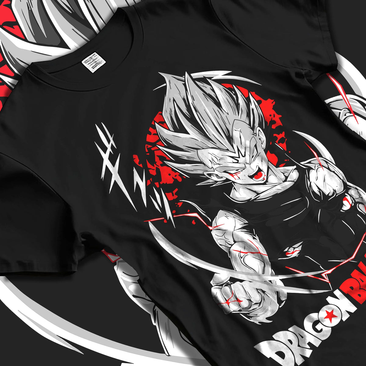 Black T-shirt laid flat with natural folds featuring Vegeta Ultra Ego God of Destruction power Dragon Ball Super artwork.
