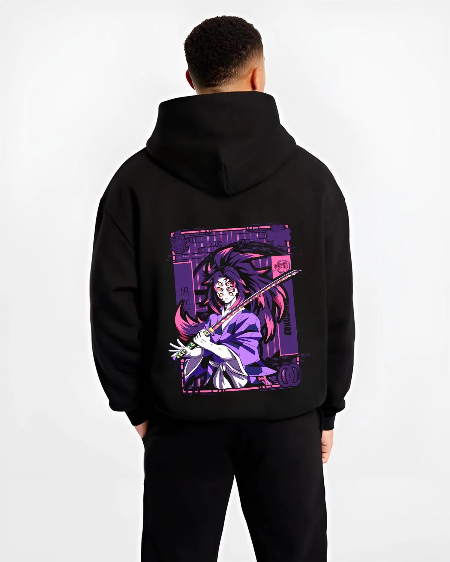 Black hoodie worn by male model, back view with Upper Moon Hoodie Demon Slayer Demonic Power graphic bold anime graphic.