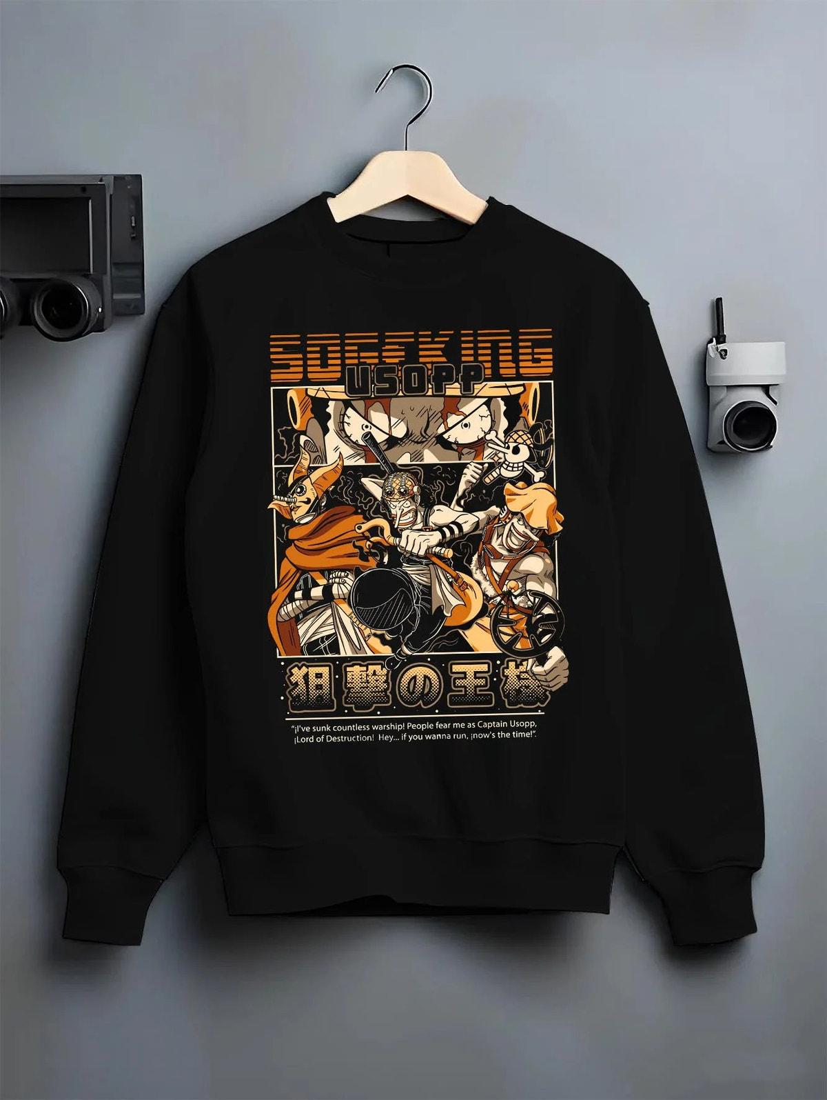 Black crewneck sweatshirt on hanger featuring Usopp Sniper King Straw Hat pirate One Piece artwork.