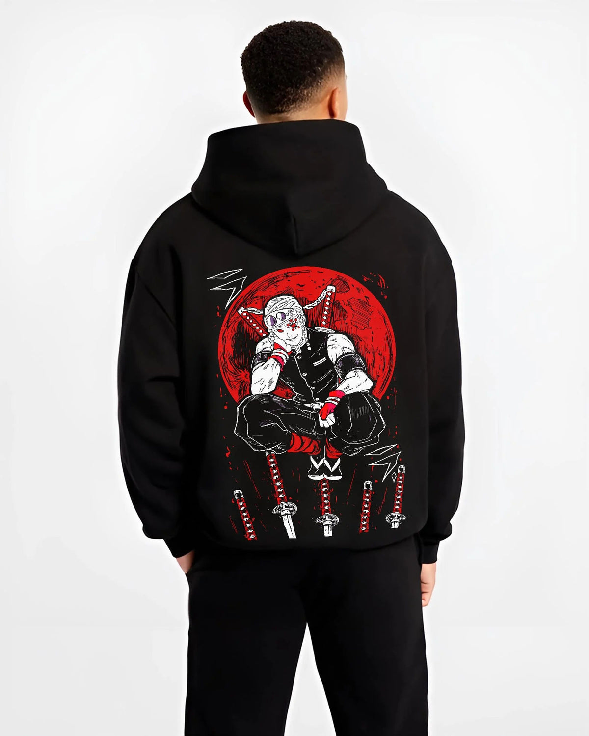 Black hoodie worn by male model from the back featuring Tengen Uzui Sound Hashira flame battle Demon Slayer artwork.