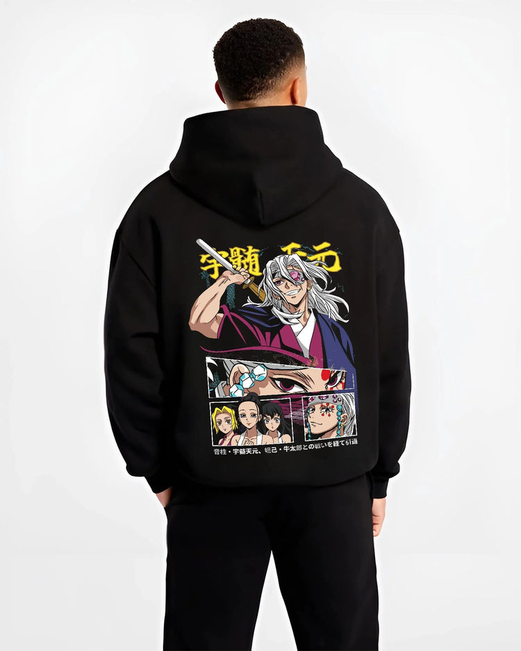 Black hoodie worn by male model from the back featuring Tengen Uzui flashy Sound Hashira Demon Slayer artwork.