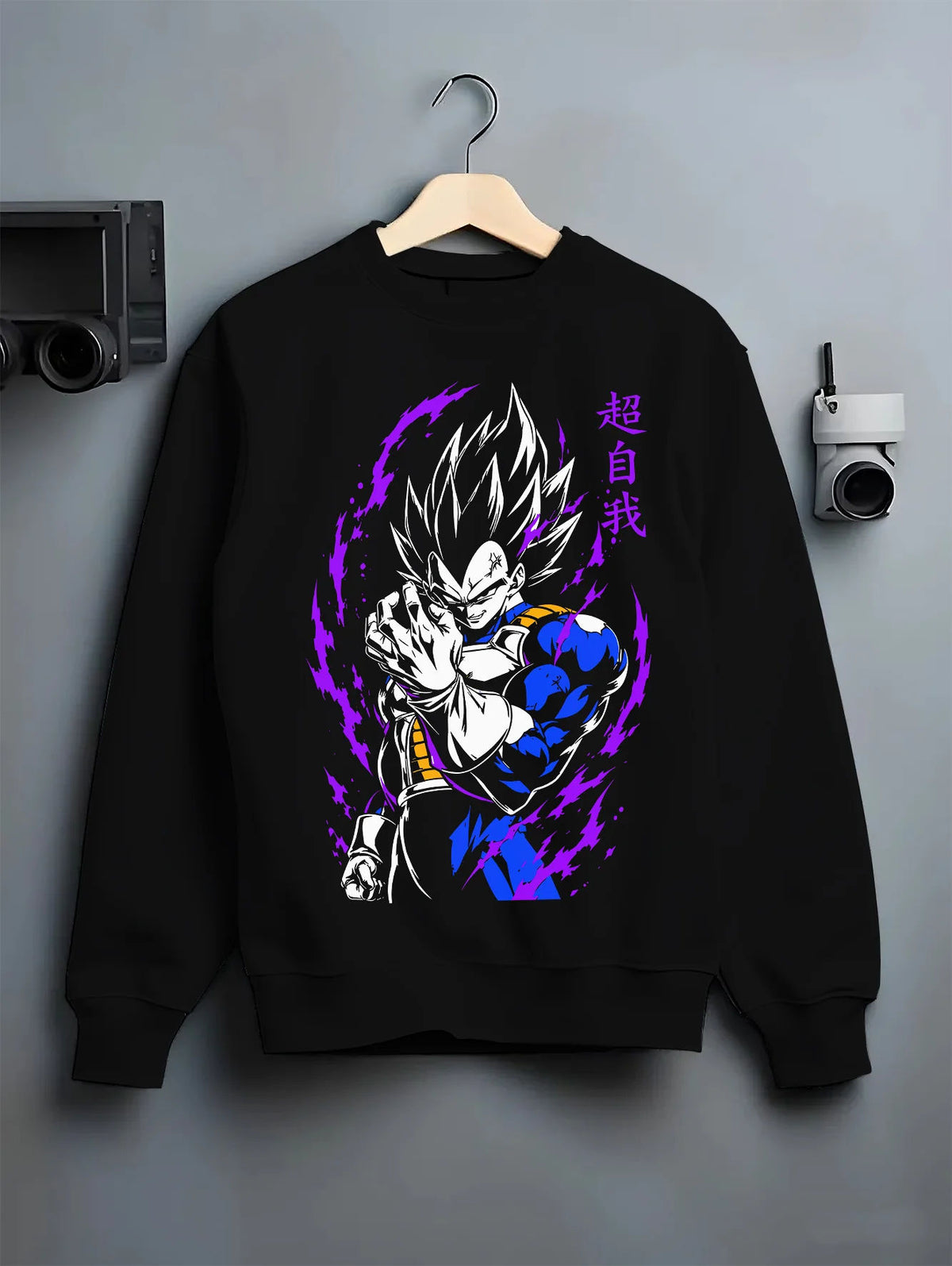 Black crewneck sweatshirt on hanger showing Vegeta from Dragon Ball: dark blue and purple power aura