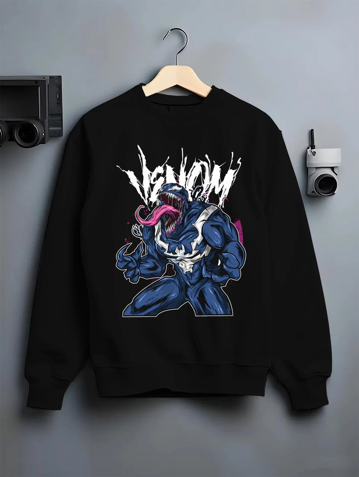 Black crewneck sweatshirt on hanger featuring Venom black symbiote Lethal Protector Marvel artwork.