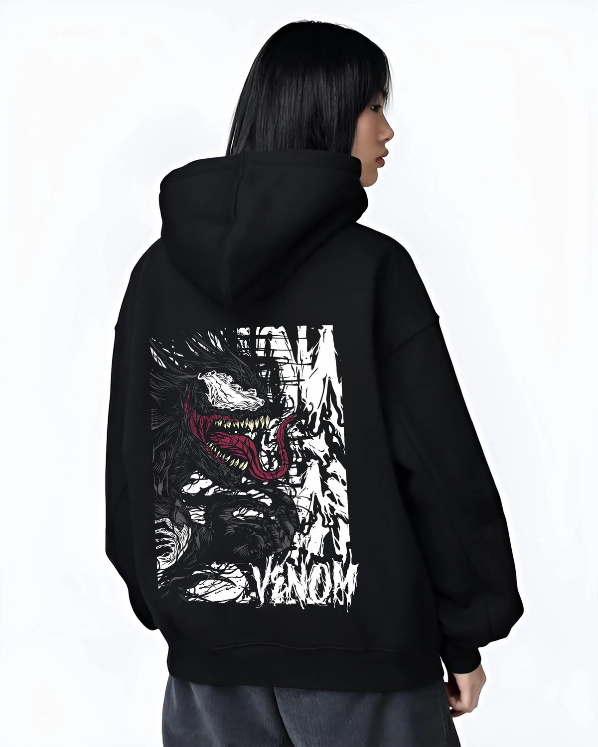 Black hoodie worn by female model from the back featuring Venom white symbiote monster portrait Marvel artwork.
