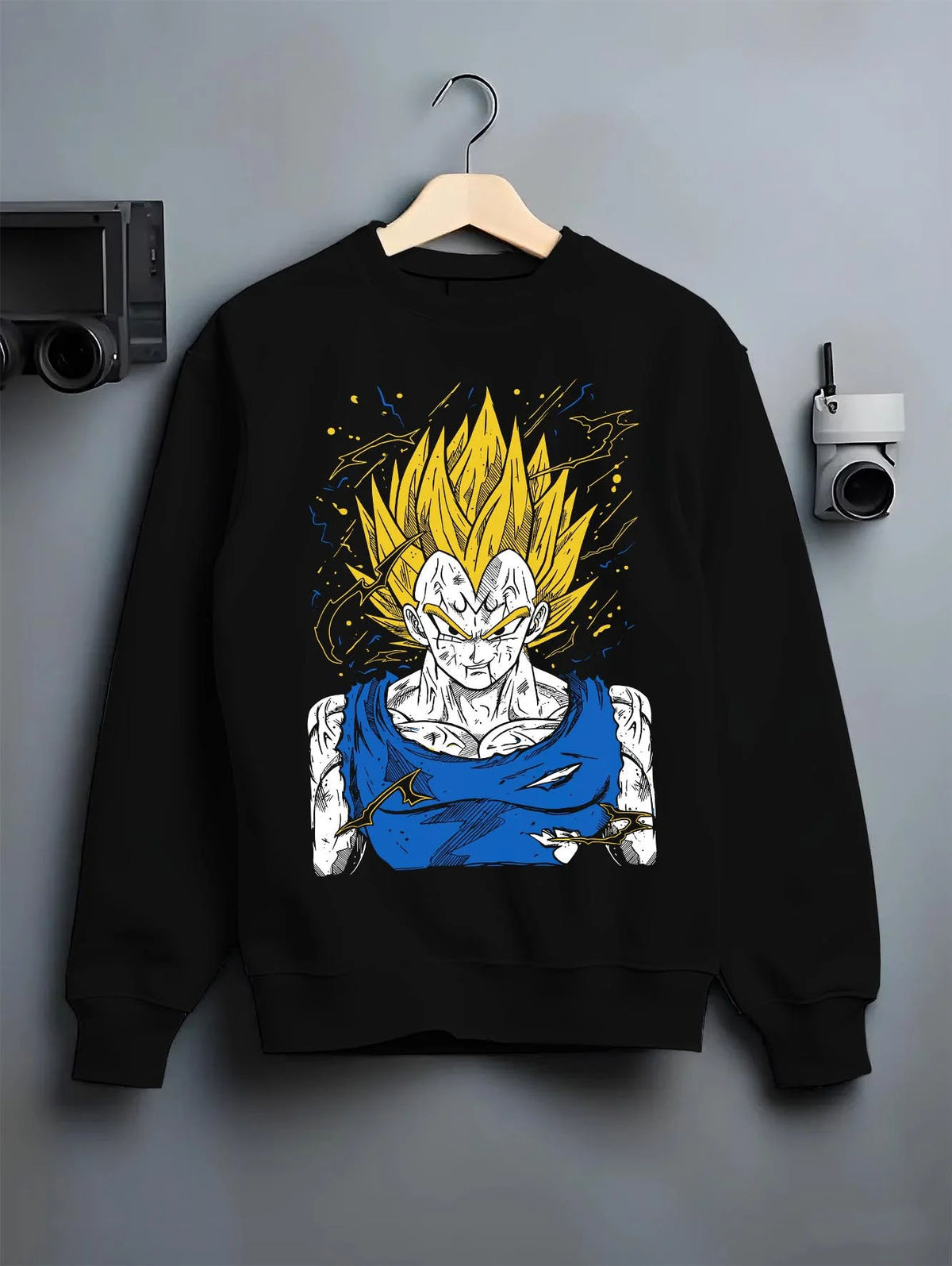 Black crewneck sweatshirt on hanger featuring Majin Vegeta battle-worn Saiyan Dragon Ball Z artwork.