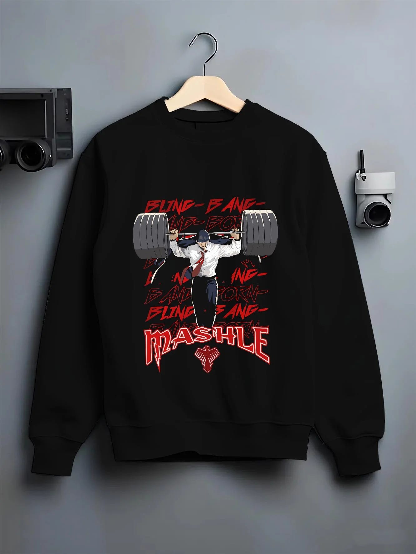 Black crewneck sweatshirt on hanger with Mash Burnedead Hoodie Mashle Muscle Weight Lift graphic streetwear graphic.
