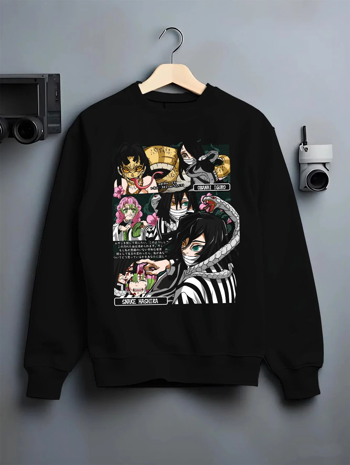 Black crewneck sweatshirt on hanger featuring Obanai Iguro Snake Hashira collage Demon Slayer artwork.