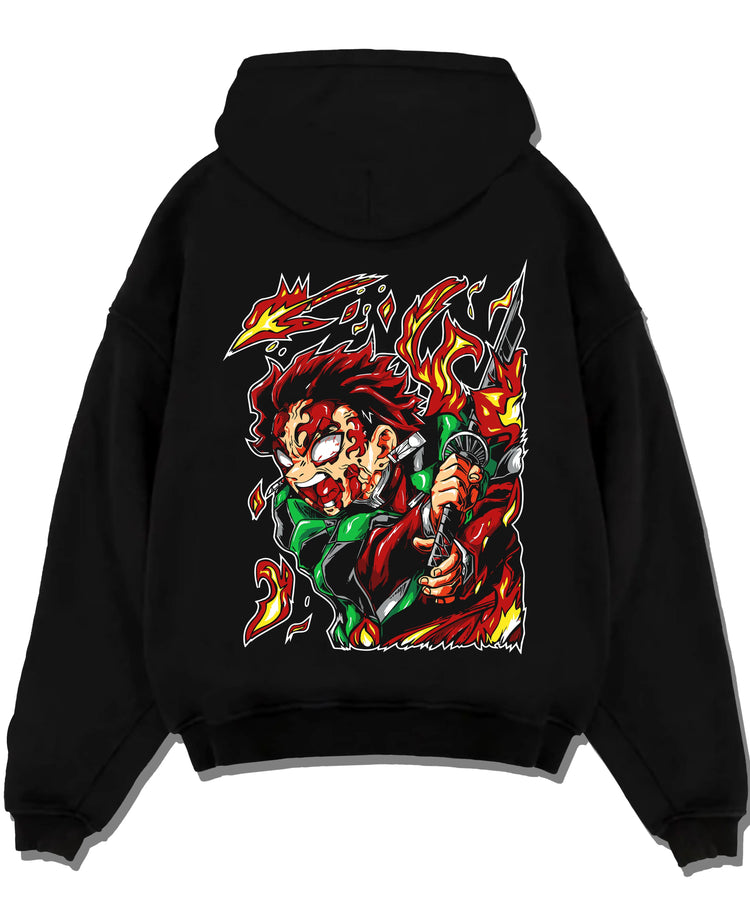 Black hoodie laid flat featuring Tanjiro Kamado Hinokami fire dragon Demon Slayer artwork.