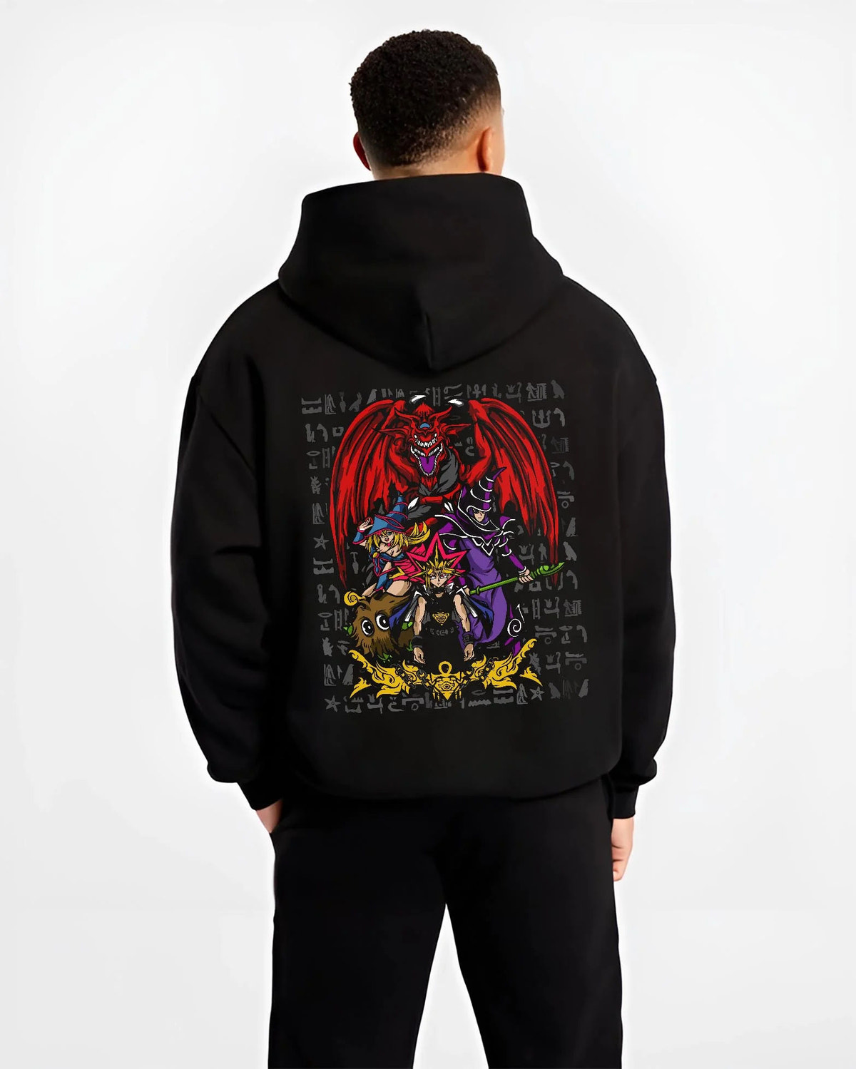 Black hoodie worn by male model from the back featuring Yugi Egyptian God Cards duel Yu-Gi-Oh! artwork.