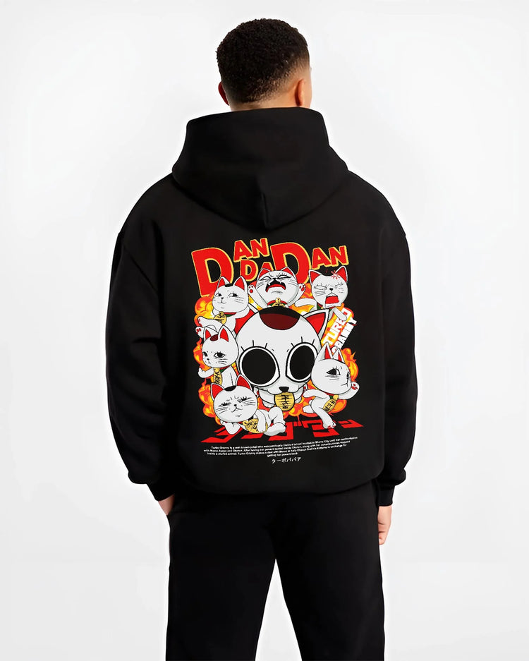 Black hoodie worn by male model, back view with Turbo Granny Hoodie Dandadan Lucky Cat Spirit Anime graphic premium wear.