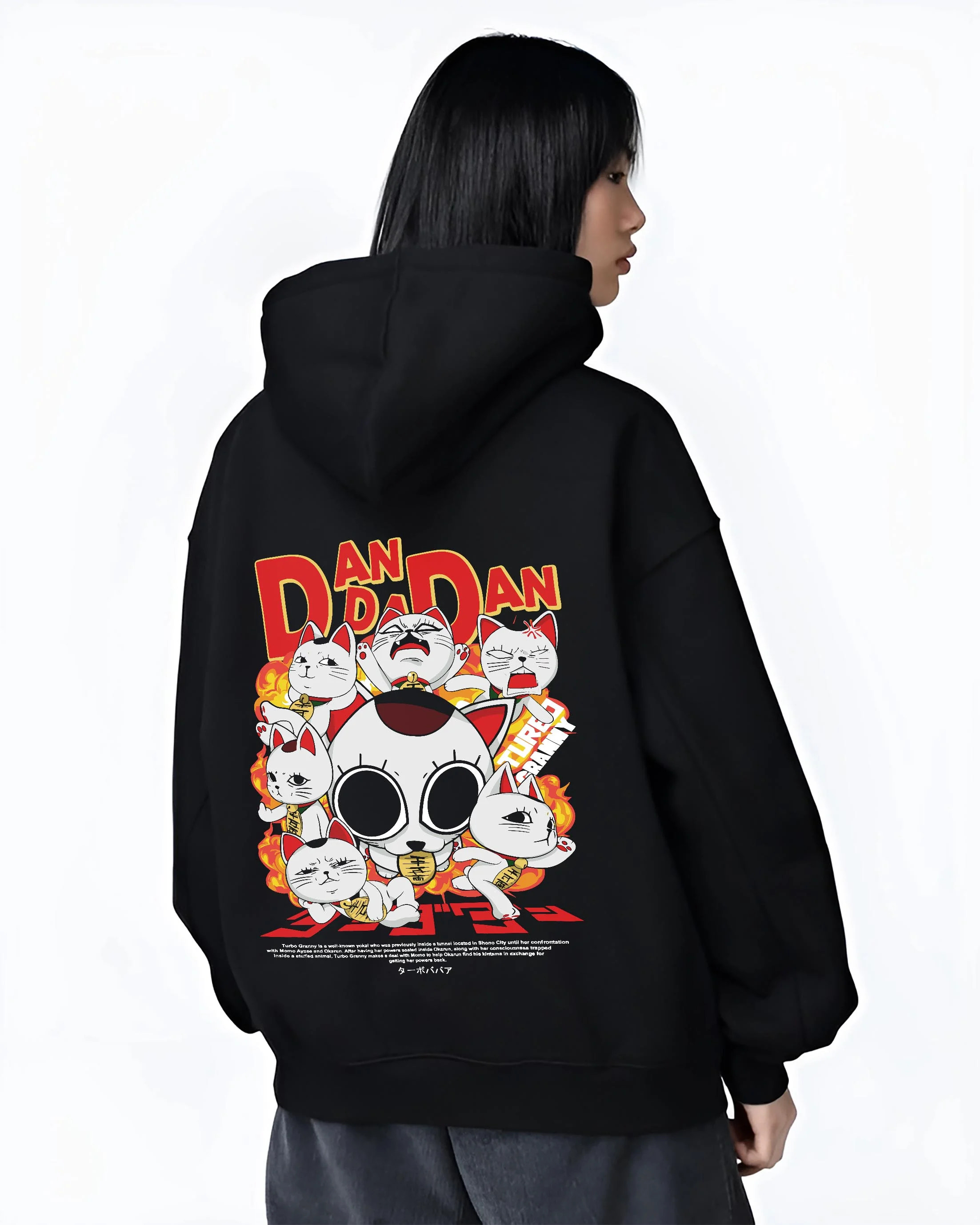 Black hoodie worn by female model, back view with Turbo Granny Hoodie Dandadan Lucky Cat Spirit Anime graphic streetwear graphic.