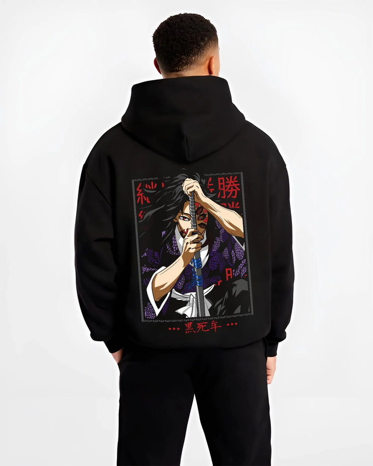 Black hoodie worn by male model from the back featuring Yoriichi Tsugikuni Sun Breathing flame aura Demon Slayer artwork.
