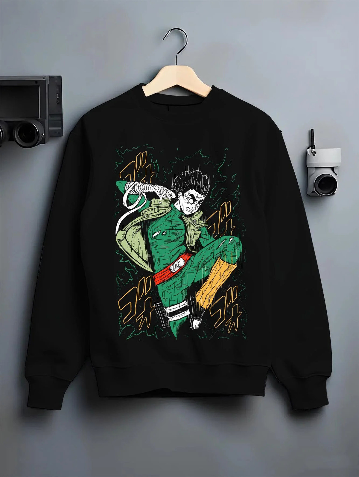 Black crewneck sweatshirt on hanger featuring Might Guy Power of Youth taijutsu Naruto artwork.