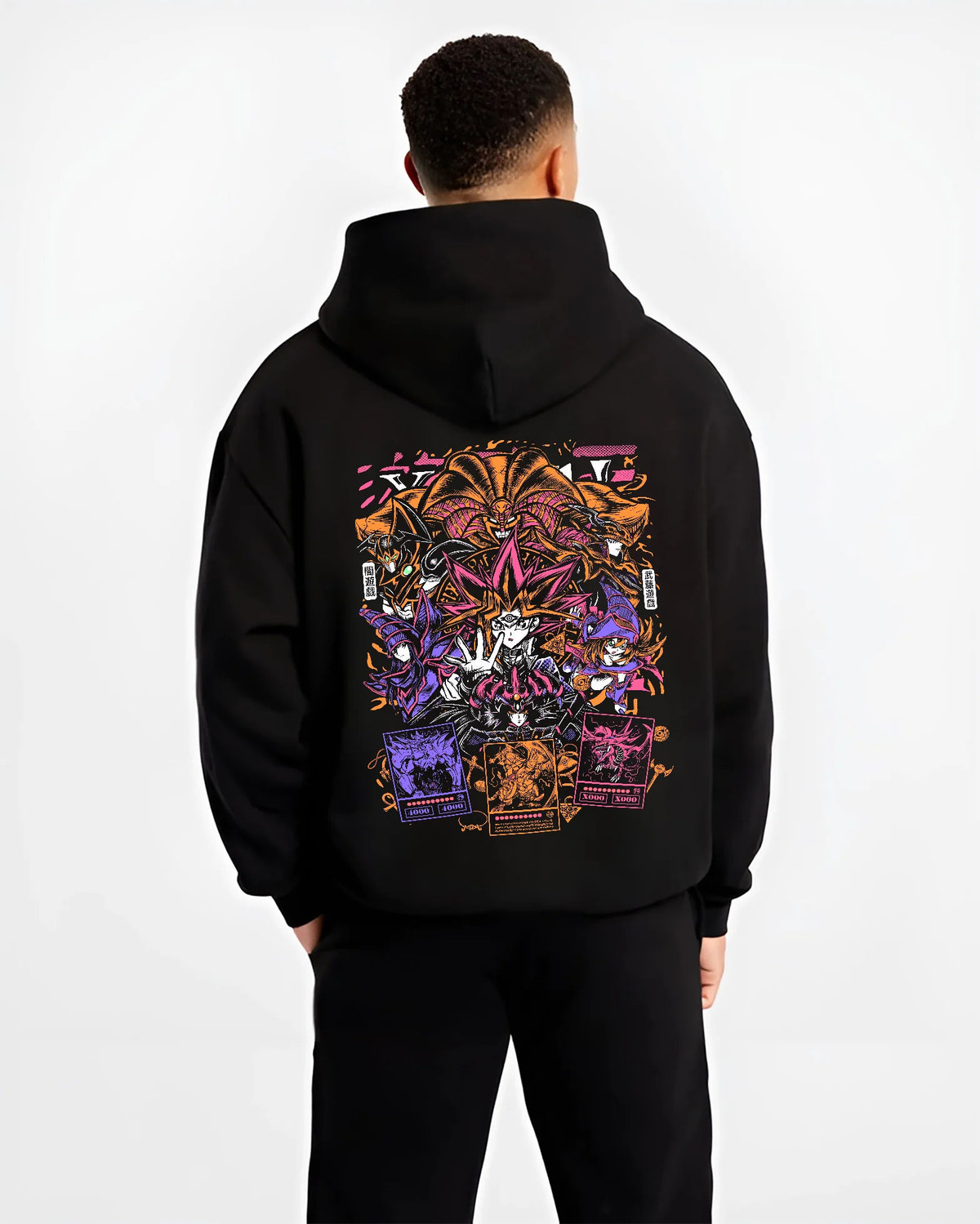 Black hoodie model back view with Yu-Gi-Oh! monsters and duelling cards collage illustrated back graphic