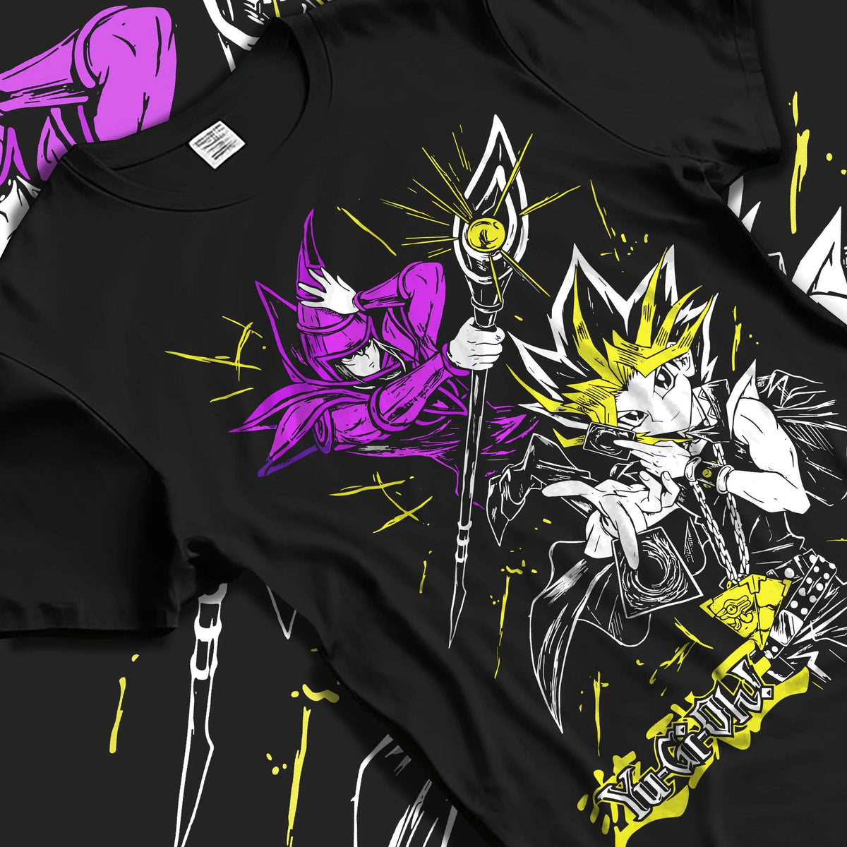 Black T-shirt laid flat with natural folds featuring Yugi Millennium Puzzle King of Games Yu-Gi-Oh! artwork.