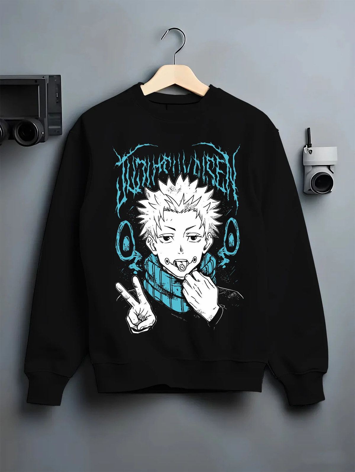 Black crewneck sweatshirt on hanger showing Yuji Itadori from Jujutsu Kaisen: eating Sukuna finger