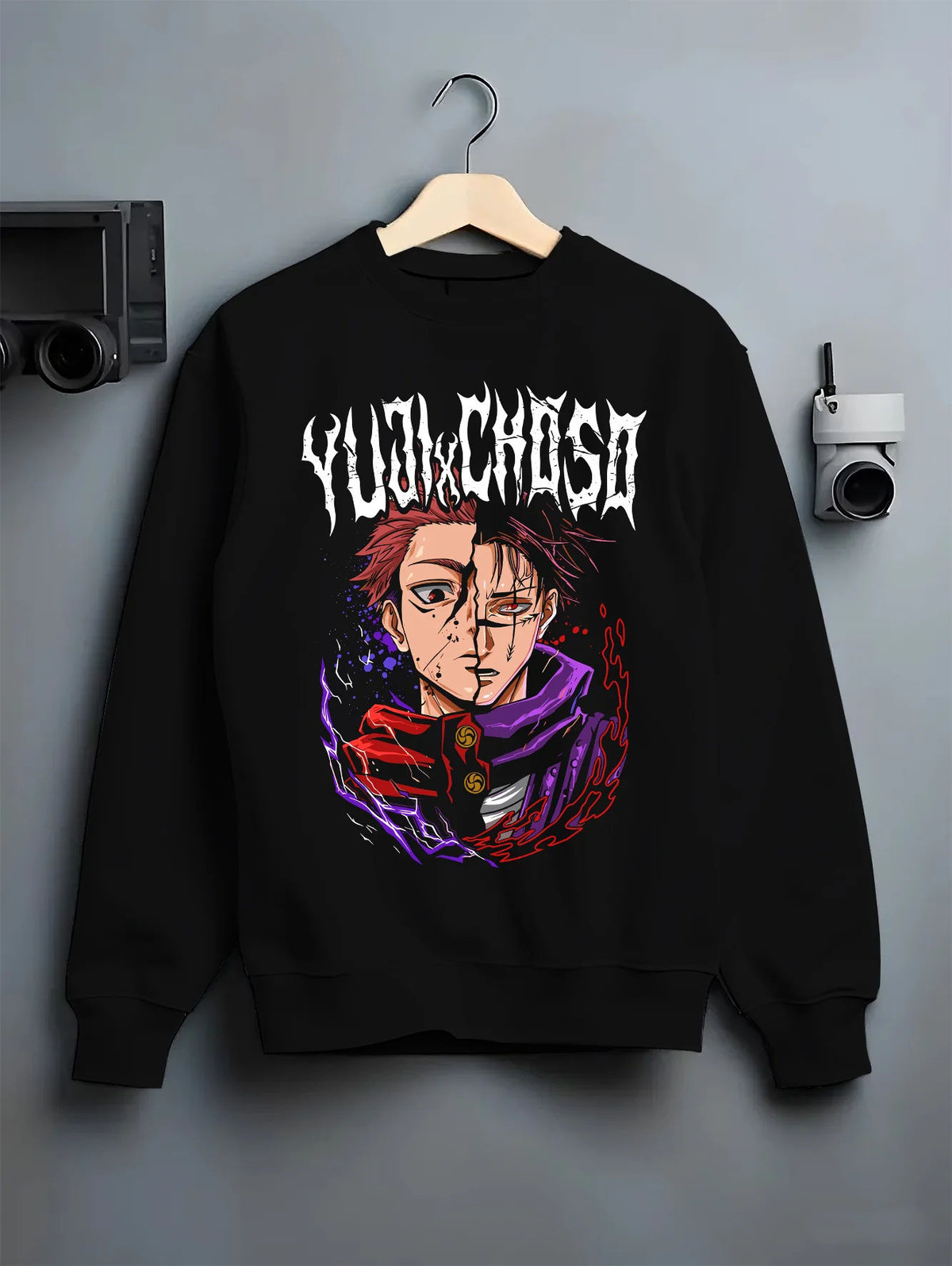 Black crewneck sweatshirt on hanger showing Yuji Itadori / Sukuna from Jujutsu Kaisen: half-face purple portrait