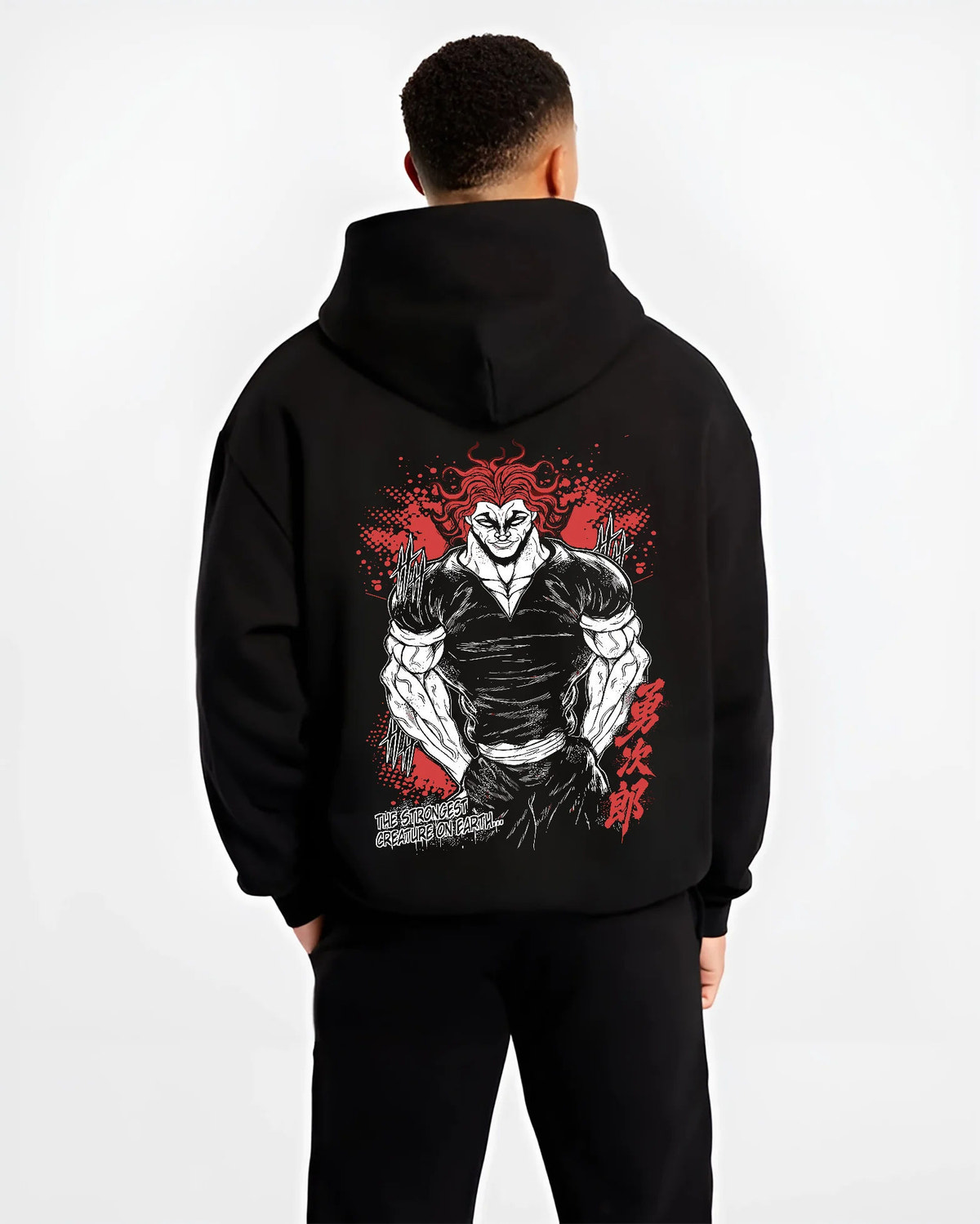 Black hoodie model back view with Yujiro Hanma (muscular, red-haired portrait) from Baki illustrated back graphic
