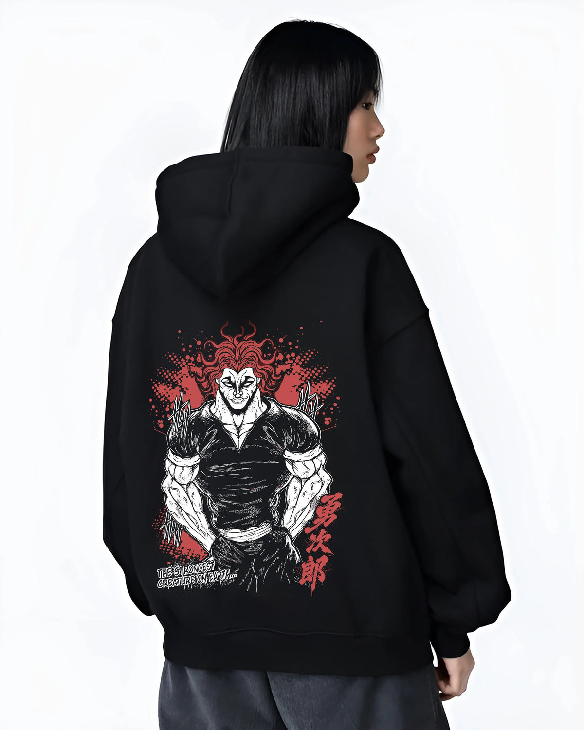 Black hoodie female model back view with Yujiro Hanma (muscular, red-haired portrait) from Baki illustrated back graphic