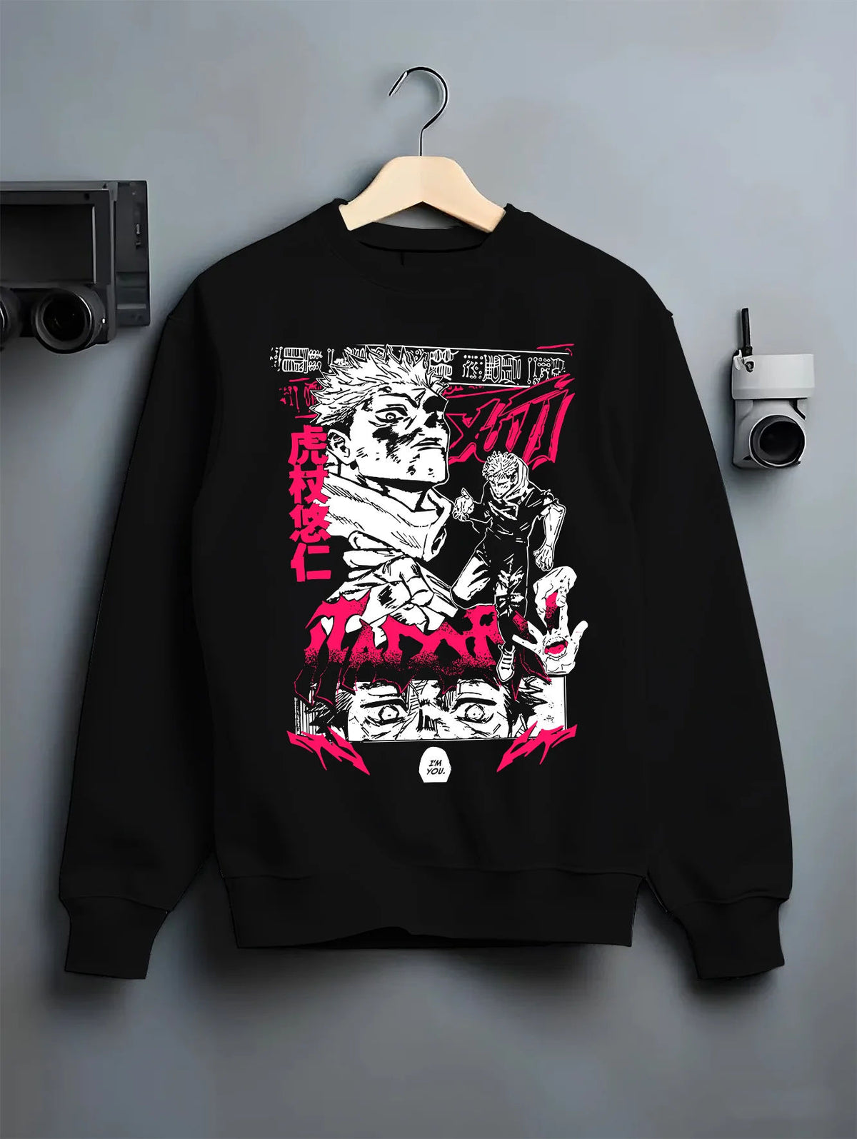 Black crewneck sweatshirt on hanger showing Yuji Itadori and Sukuna from Jujutsu Kaisen: manga collage