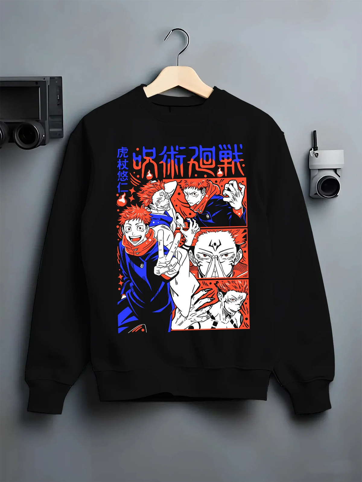 Black crewneck sweatshirt on hanger showing Yuji Itadori and Sukuna from Jujutsu Kaisen: manga montage