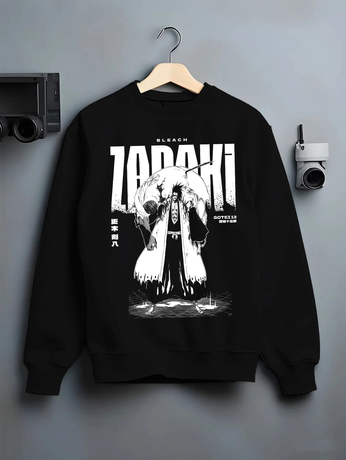 Black crewneck sweatshirt on hanger with Kenpachi Zaraki from Bleach illustrated back graphic