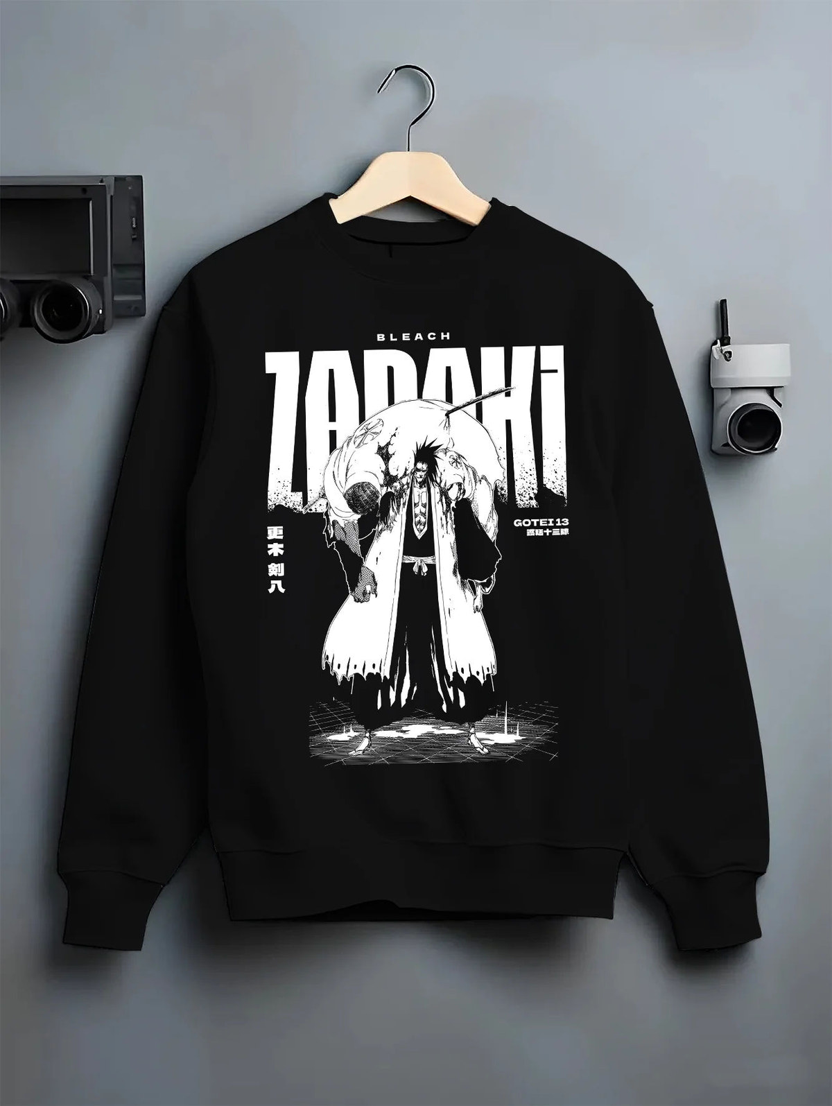Black crewneck sweatshirt on hanger with Kenpachi Zaraki from Bleach illustrated back graphic